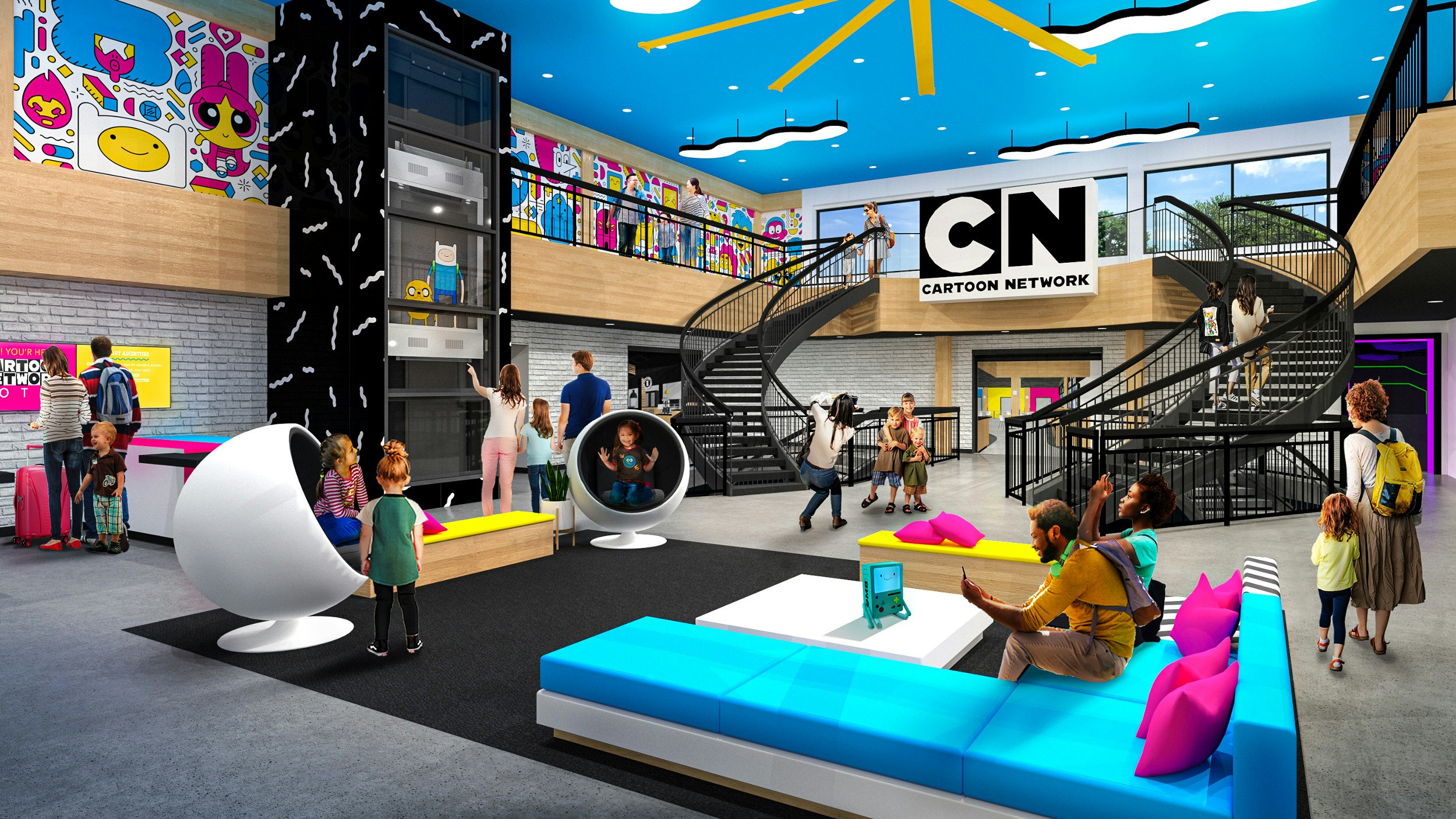 Families inside a common area at the Cartoon Network Hotel in Lancaster, Pennsylvania; the interior is decorated with artwork of the animated shows on the TV network.