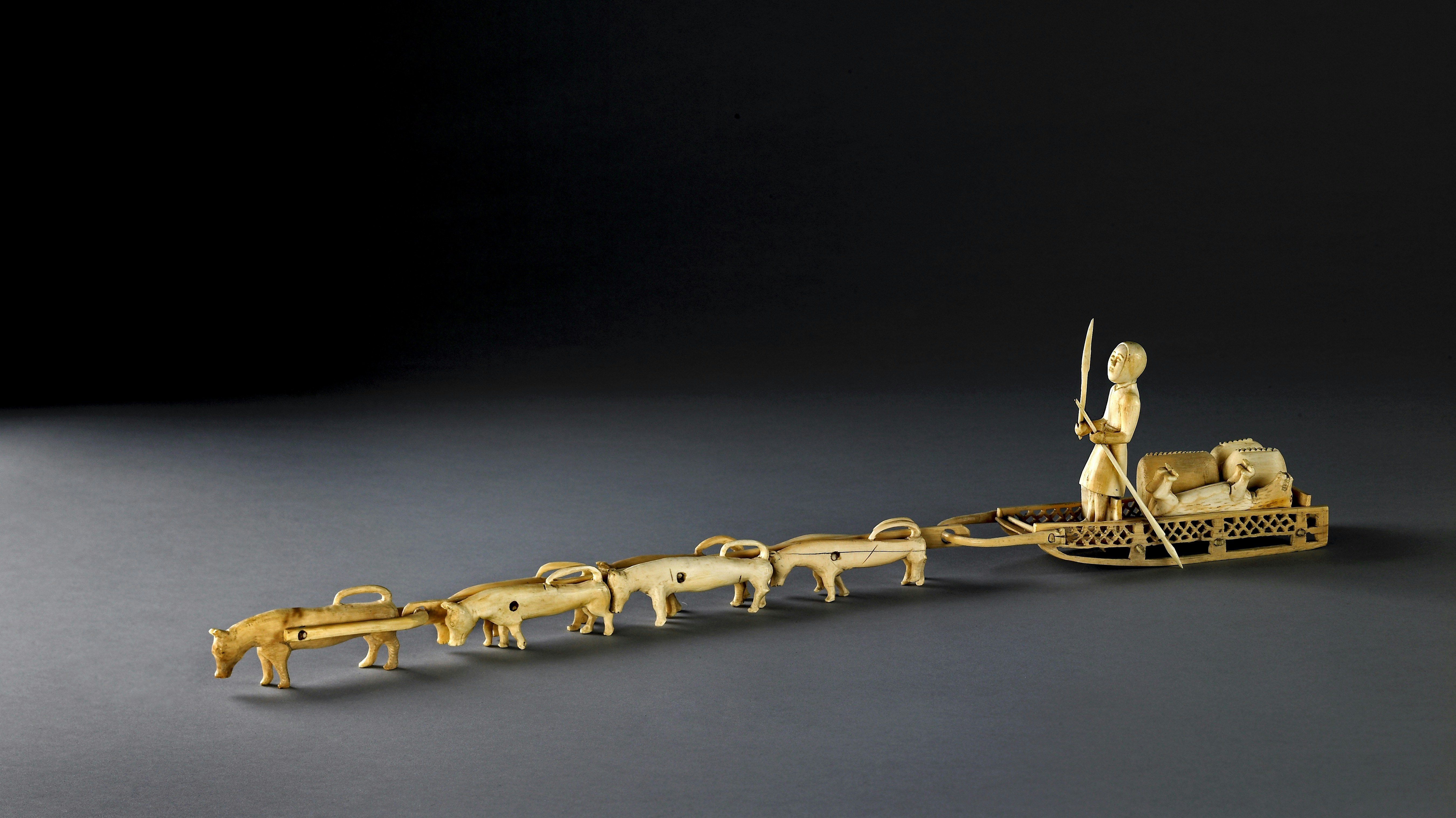 Carved ivory model group of a dog sled, British Museum