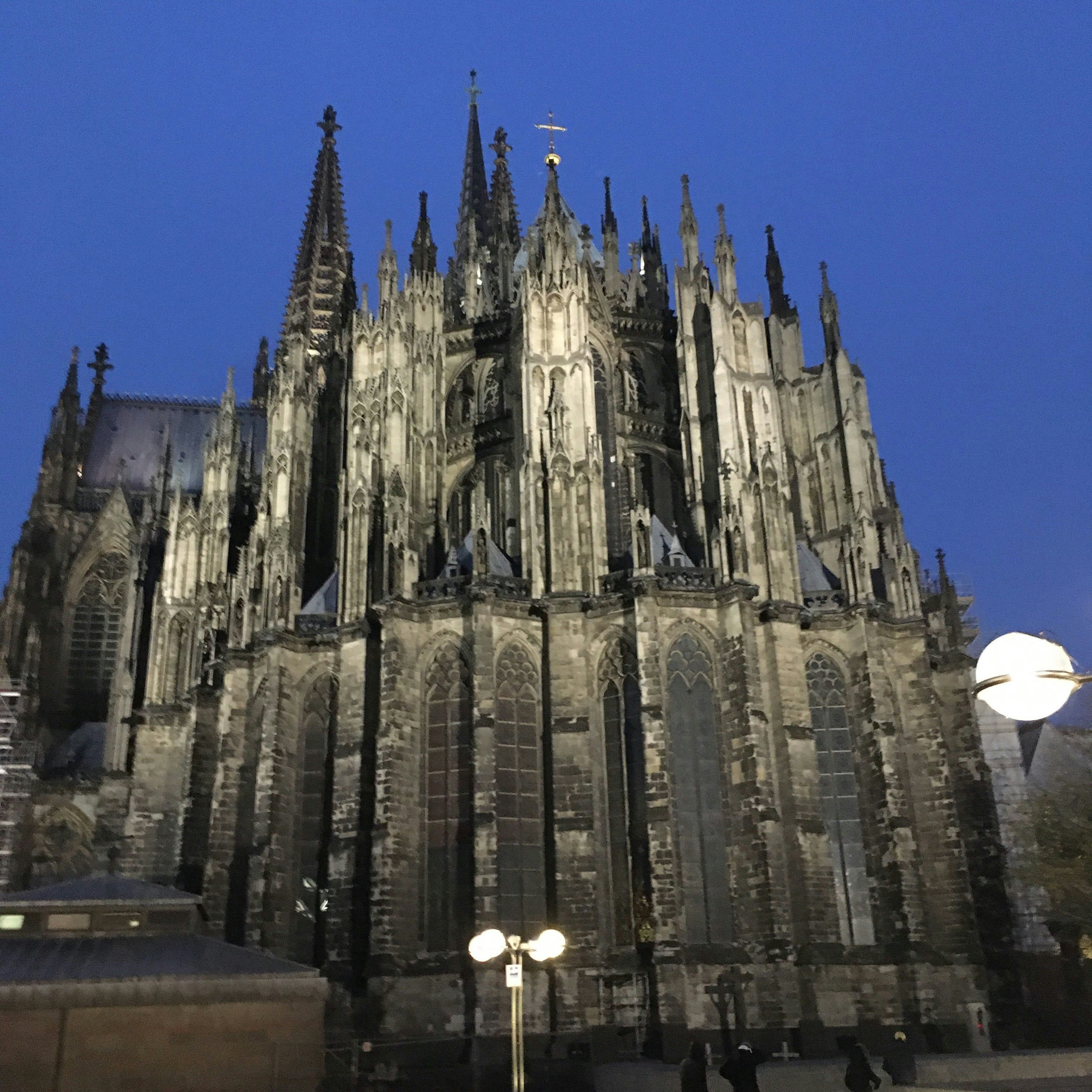The Cologne cathedral lit up at night.