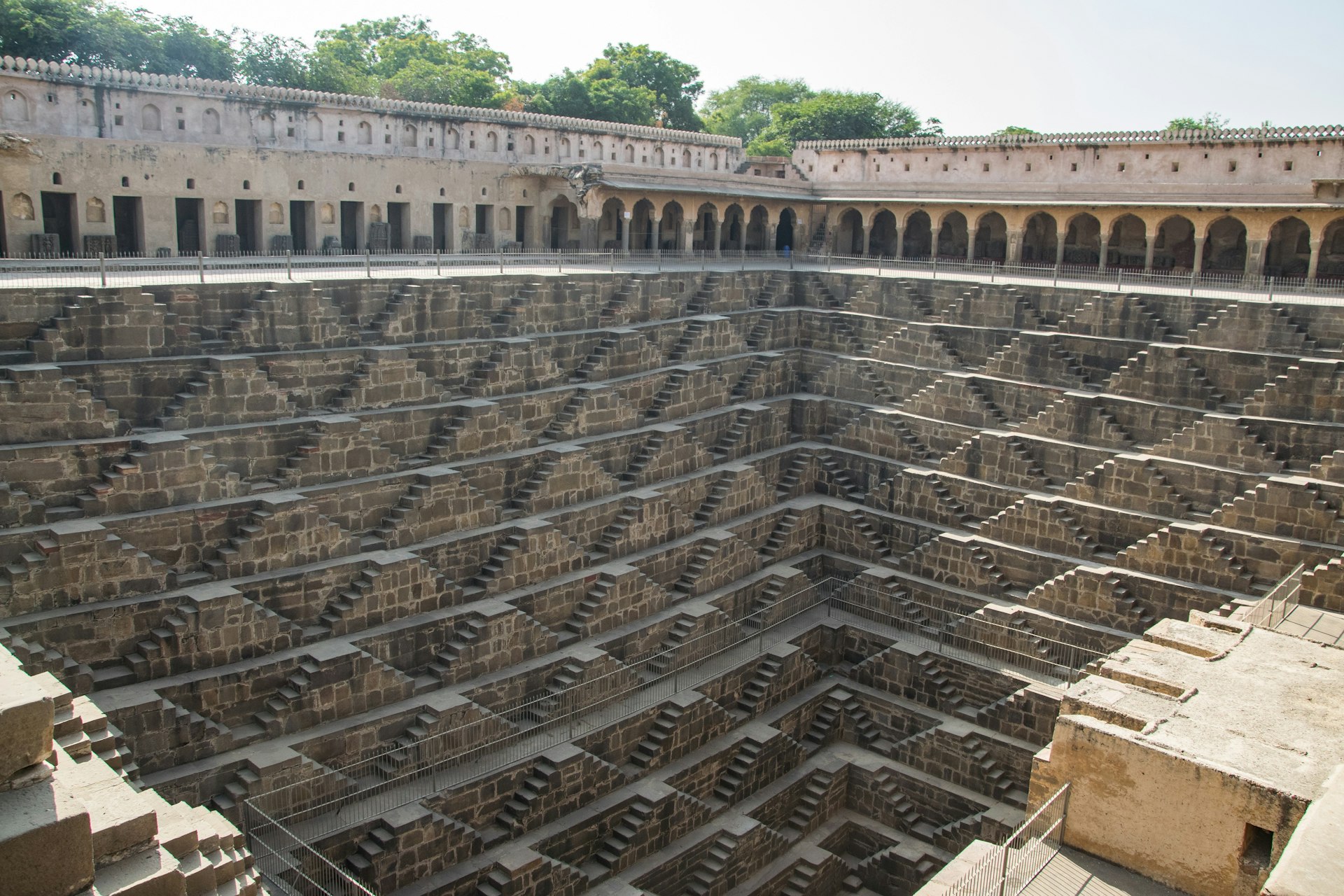 Chand Baori stepwell in Abhaneri, Rajasthan. The stepwell is huge with diagonal steps running down into the well from all sides, with the hole gradually getting smaller in size as it descends.