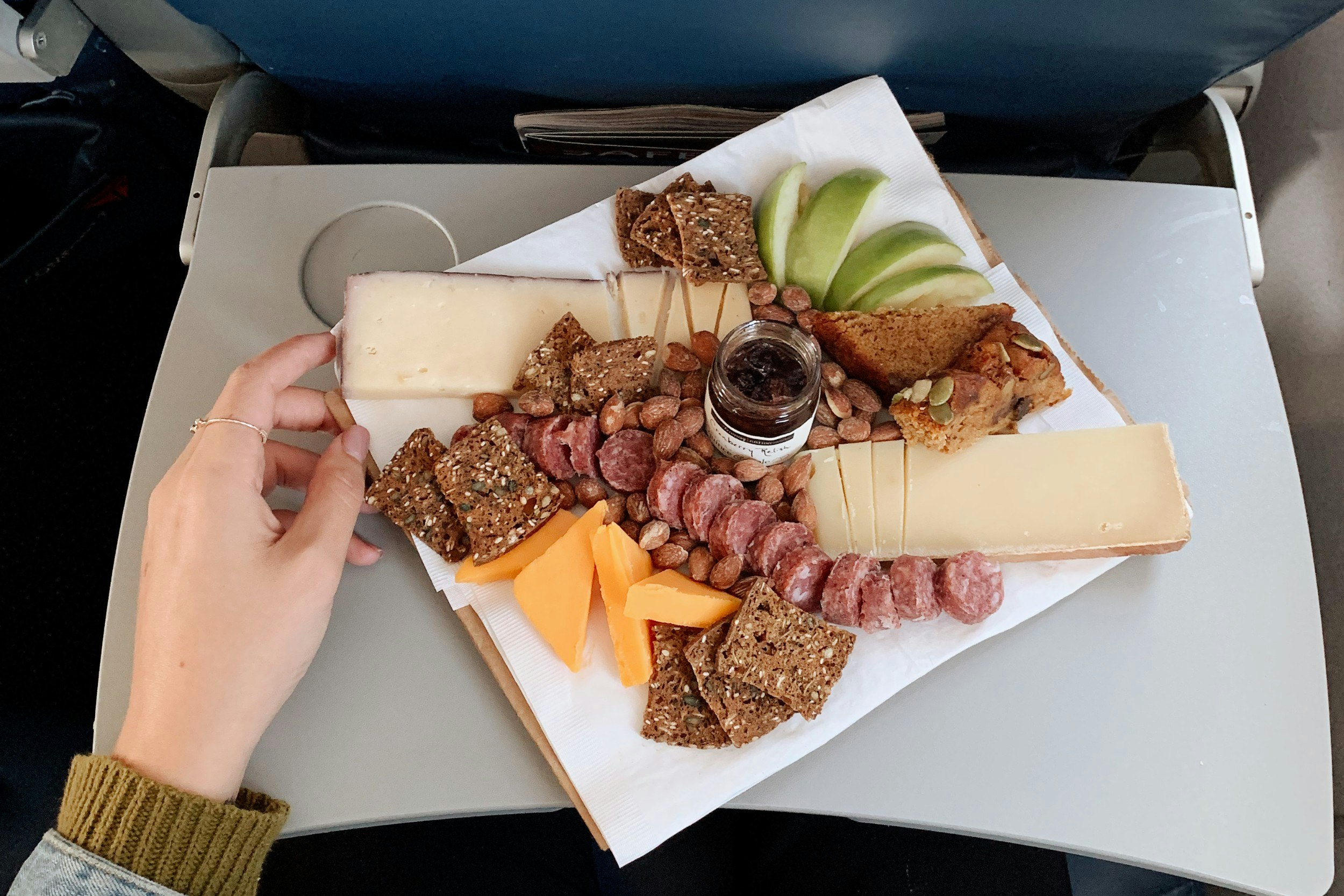 A cheese board  on a plane