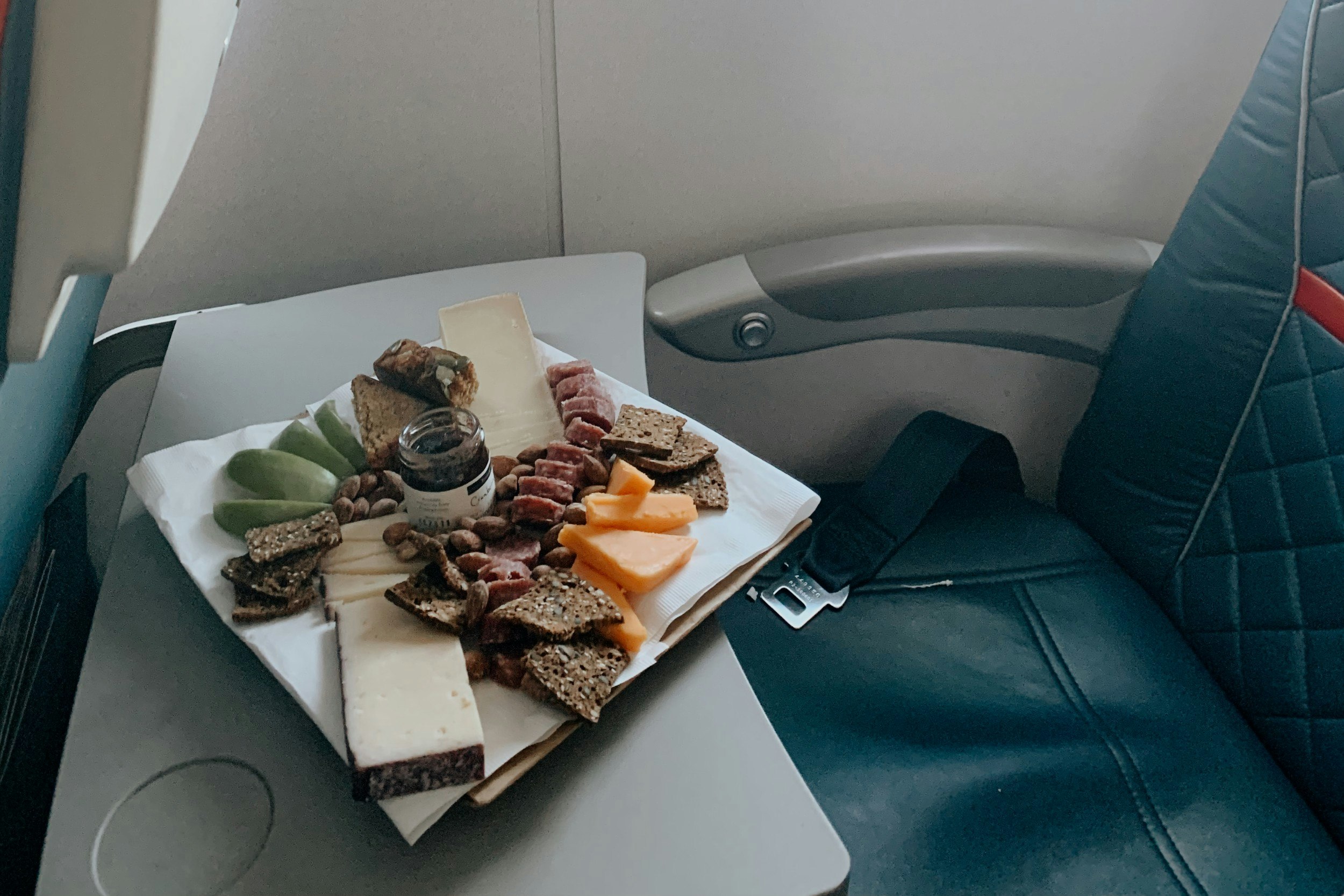 A cheese board on a plane