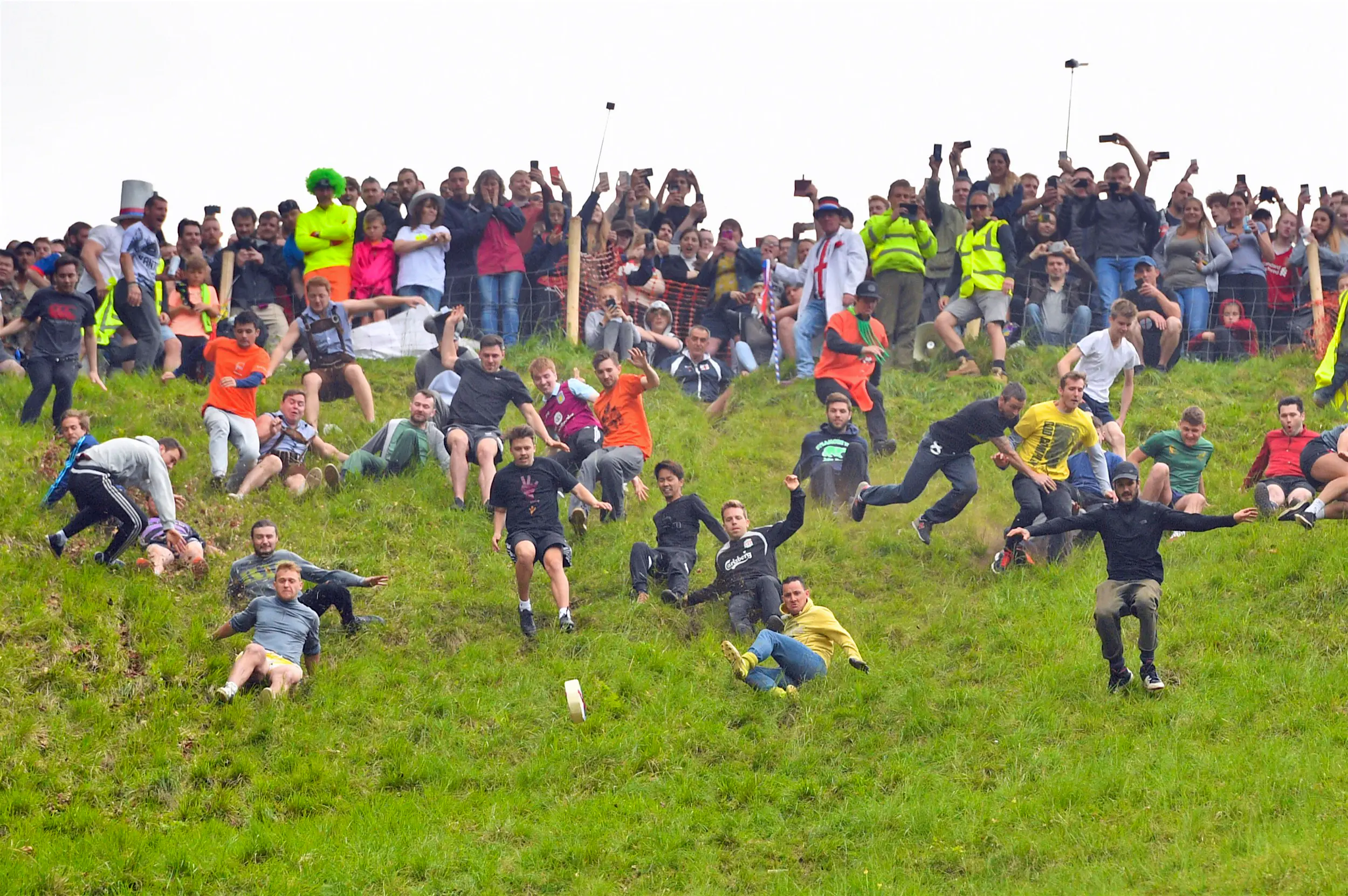 Cheese_Rolling.jpg Competitors throw themselves down a steep hill in England in a race to the bottom behind a rolling wheel of cheese; Unique sporting events