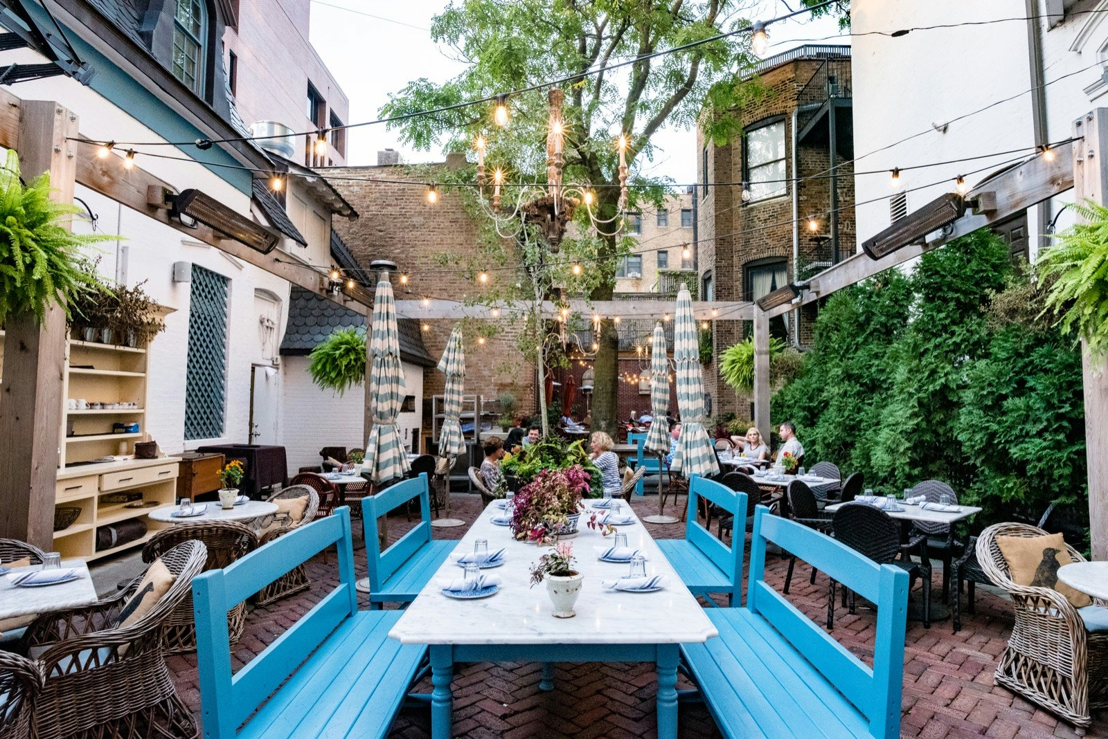 The charming patio strung with lights at the Blue Door Kitchen & Garden Patio