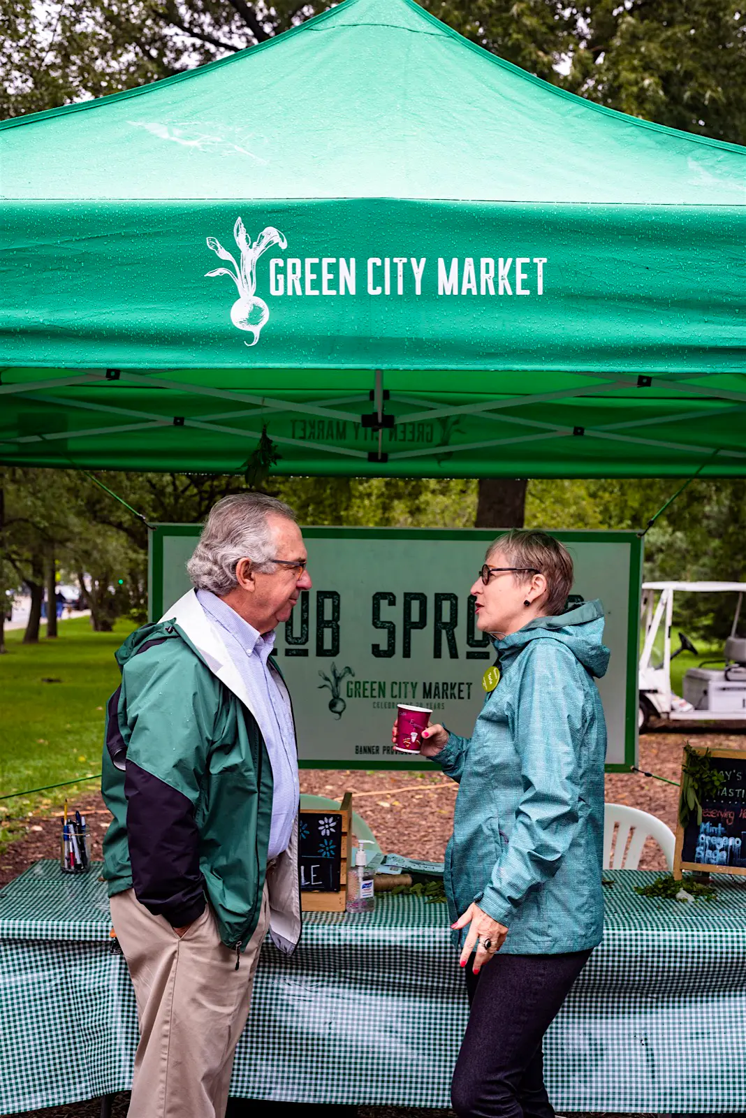 Chicago Green City Market - Lincoln Park - Anna Haines.jpg Two people chat outside a stall at a Chicago farmer's market