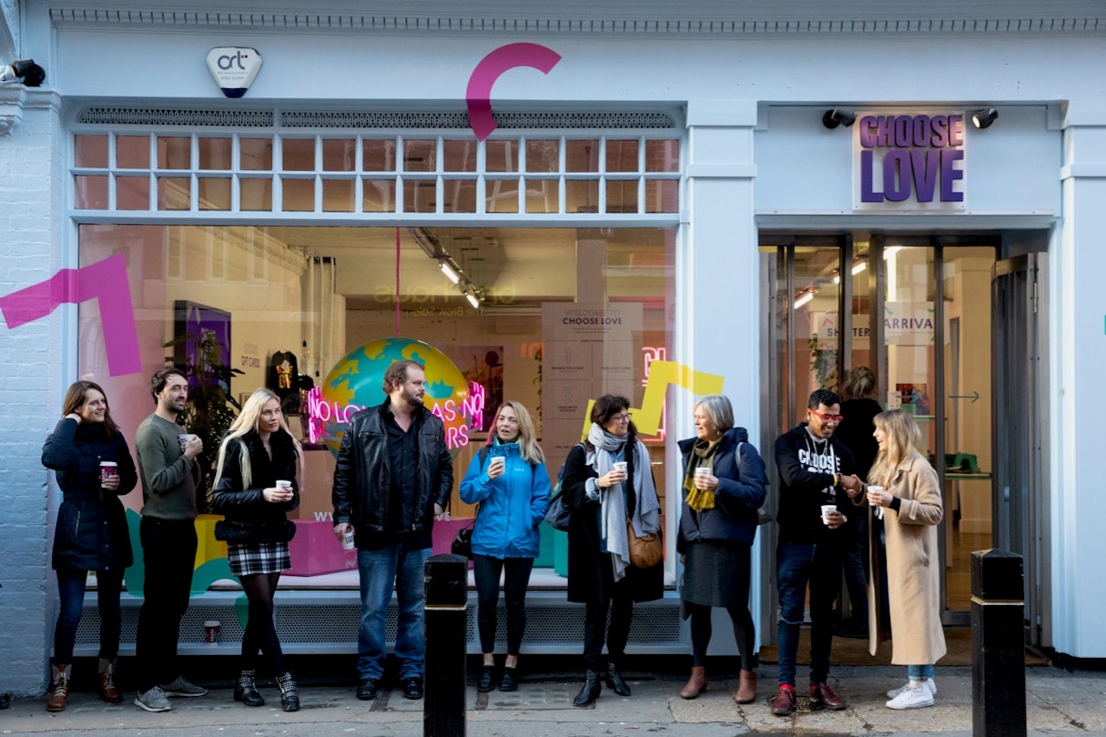 A line of people outside of London's Choose Love store at its opening