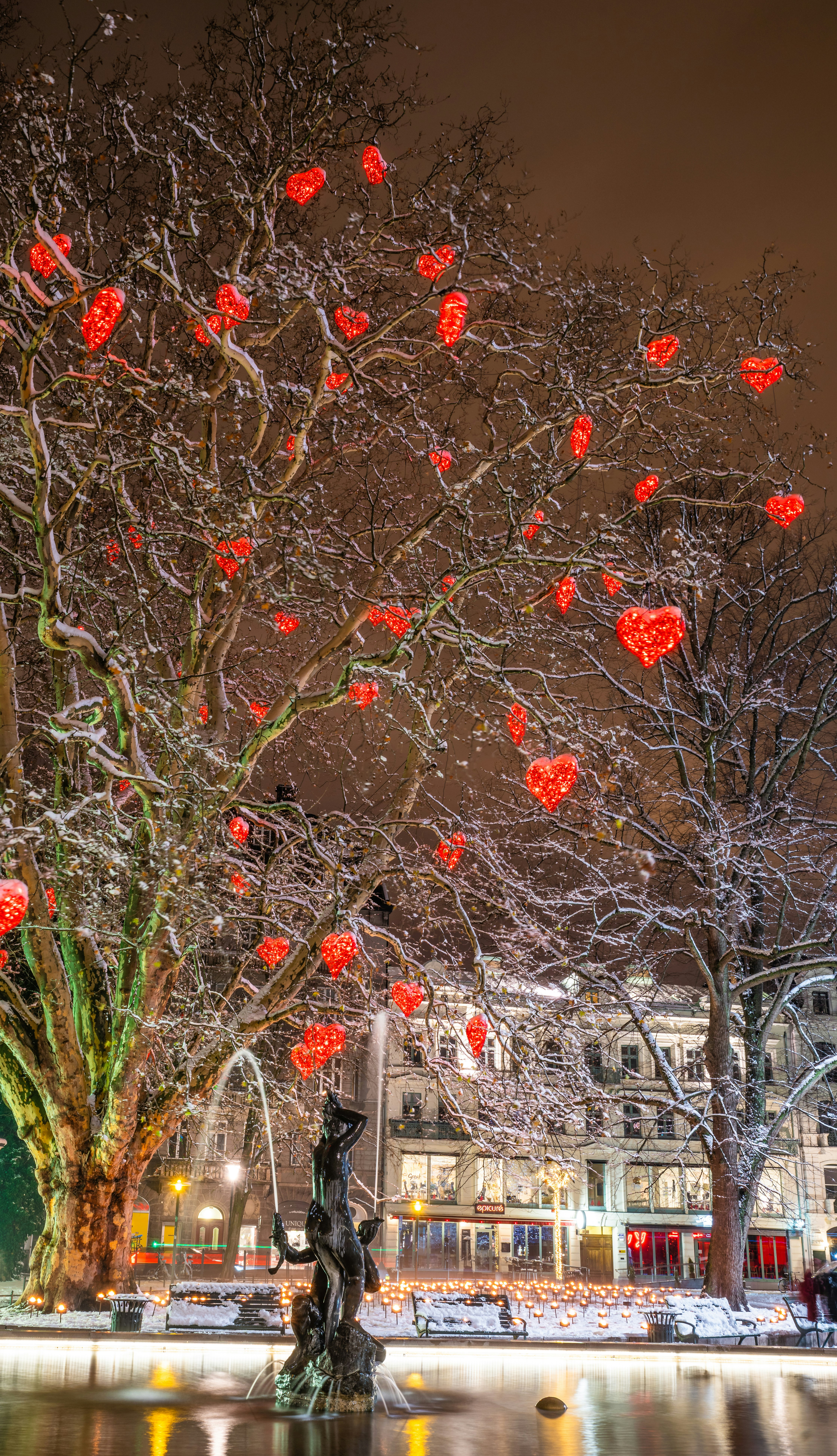 The tree of love filled with red hearts stands at Gusav Adolf's Square in Malmo at christmas time