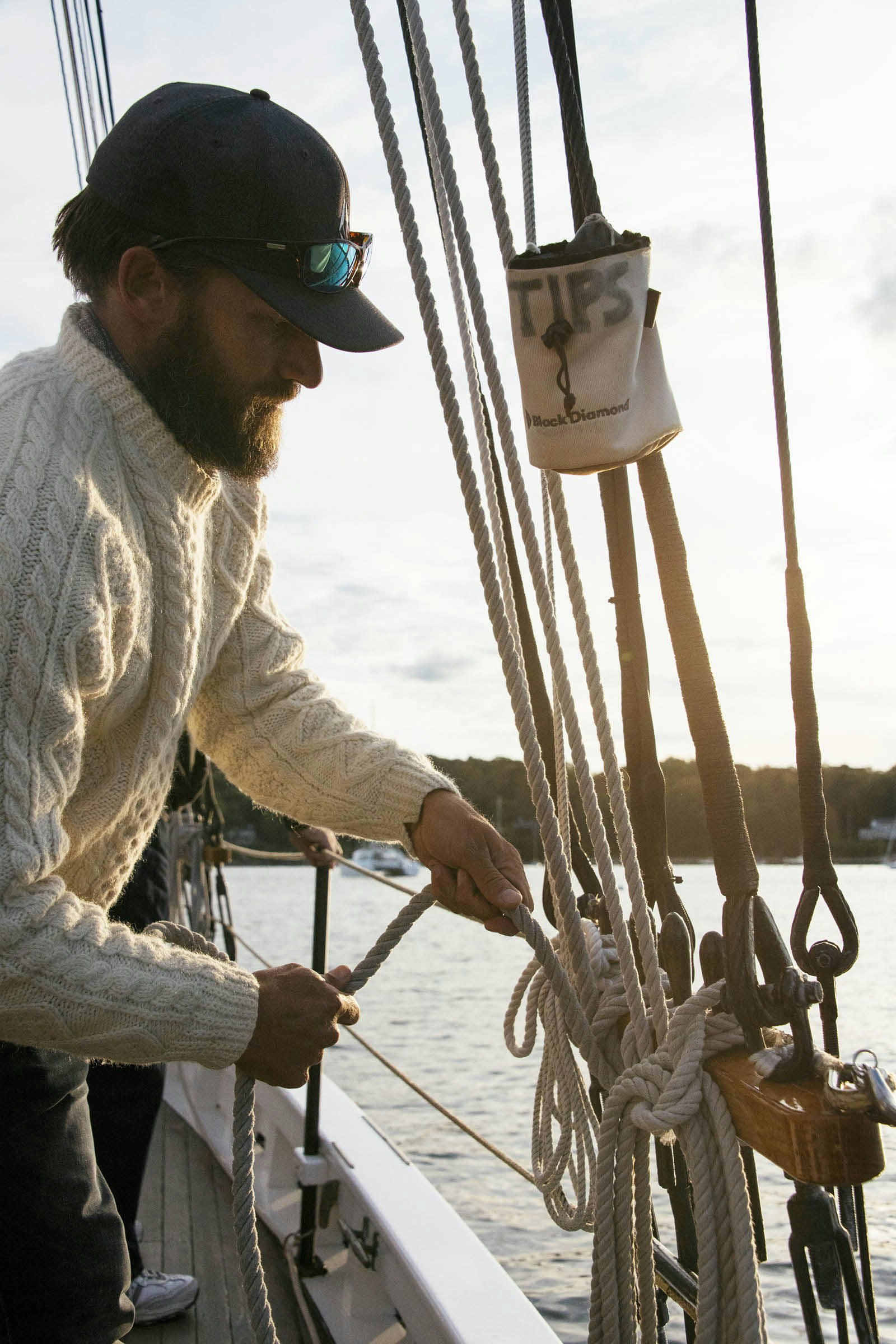 Laird Kopp attends to the rigging on the Surprise