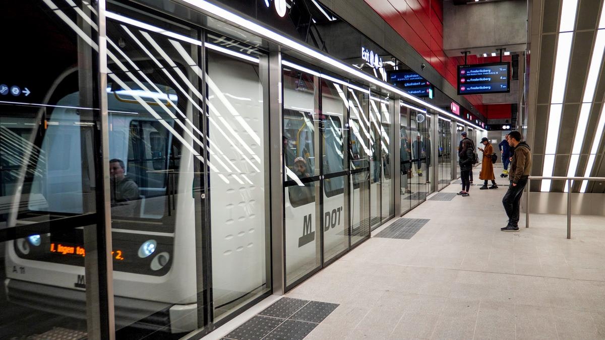 Passengers wait for the driverless metro in a Copenhagen station
