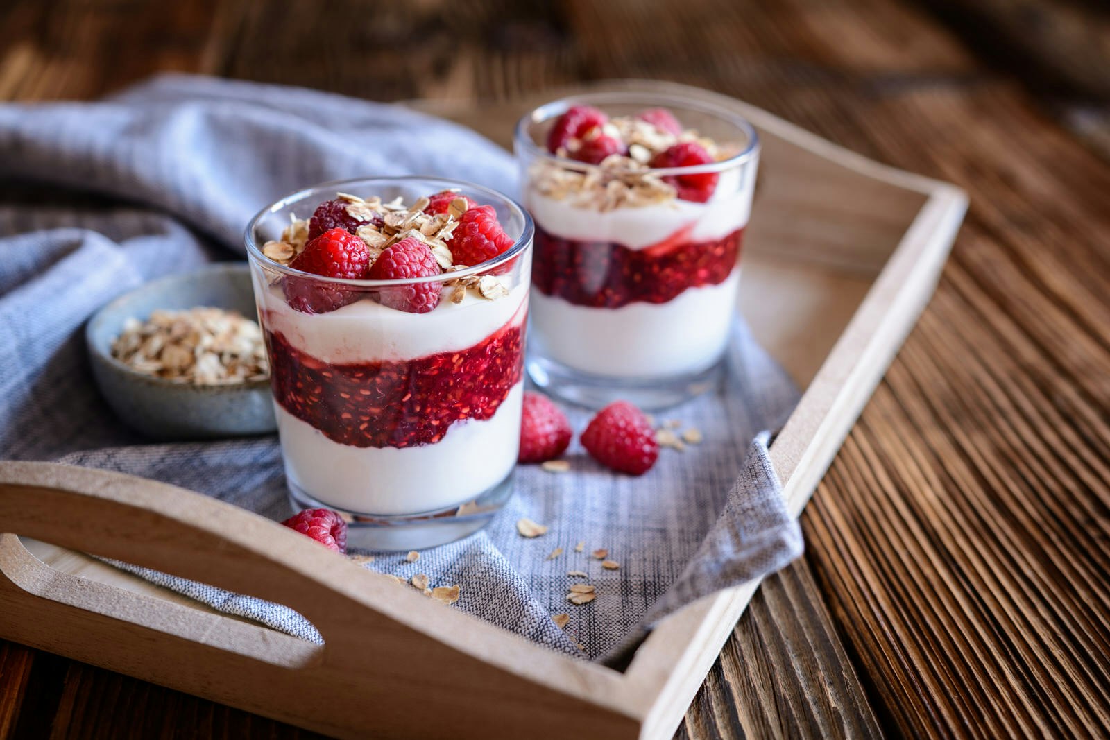 Cranachan - traditional Scottish dessert with whipped cream, roasted oatmeal and raspberries