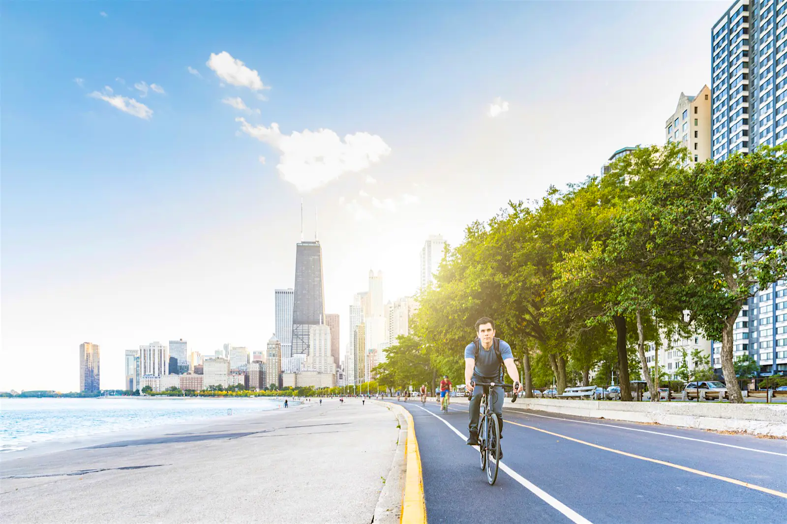 Cycling_Chicago.jpg A man rides his bike along the waterfront with the city skyline in the background