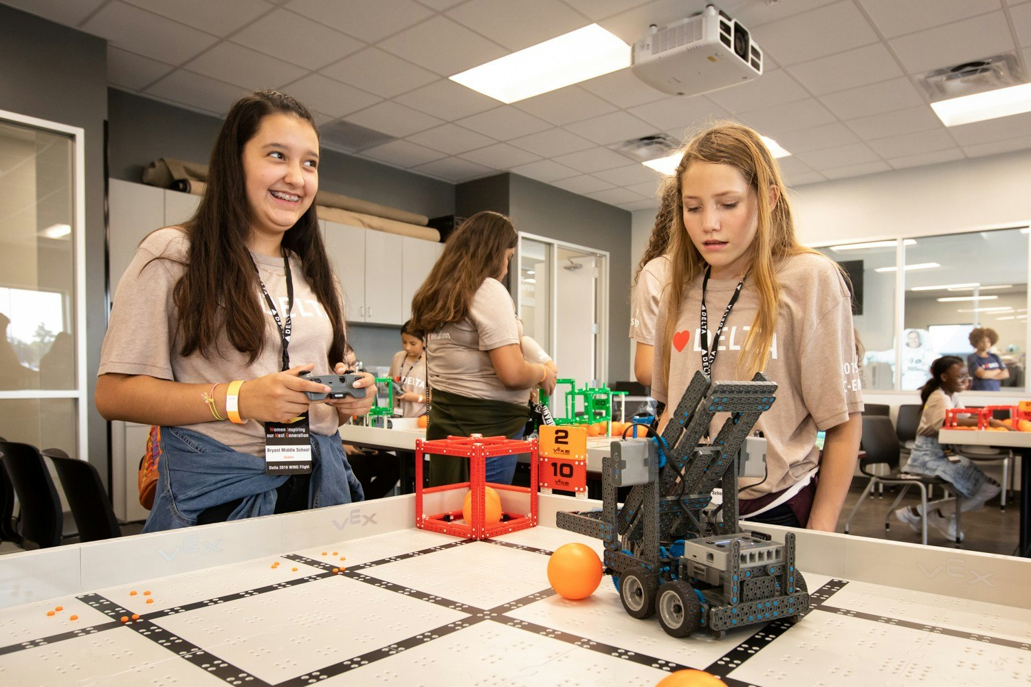 Teenage girls looking at models of flight and human space exploration at NASA