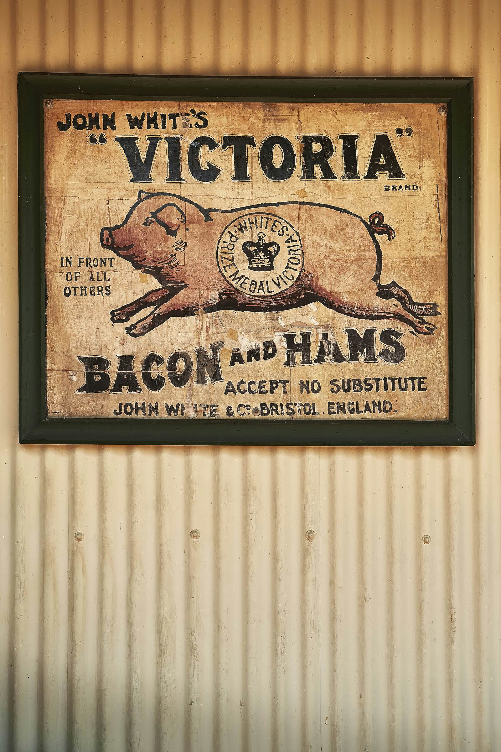A vintage sign for bacon and ham at The Vine, a pub in Pilgrim’s Rest