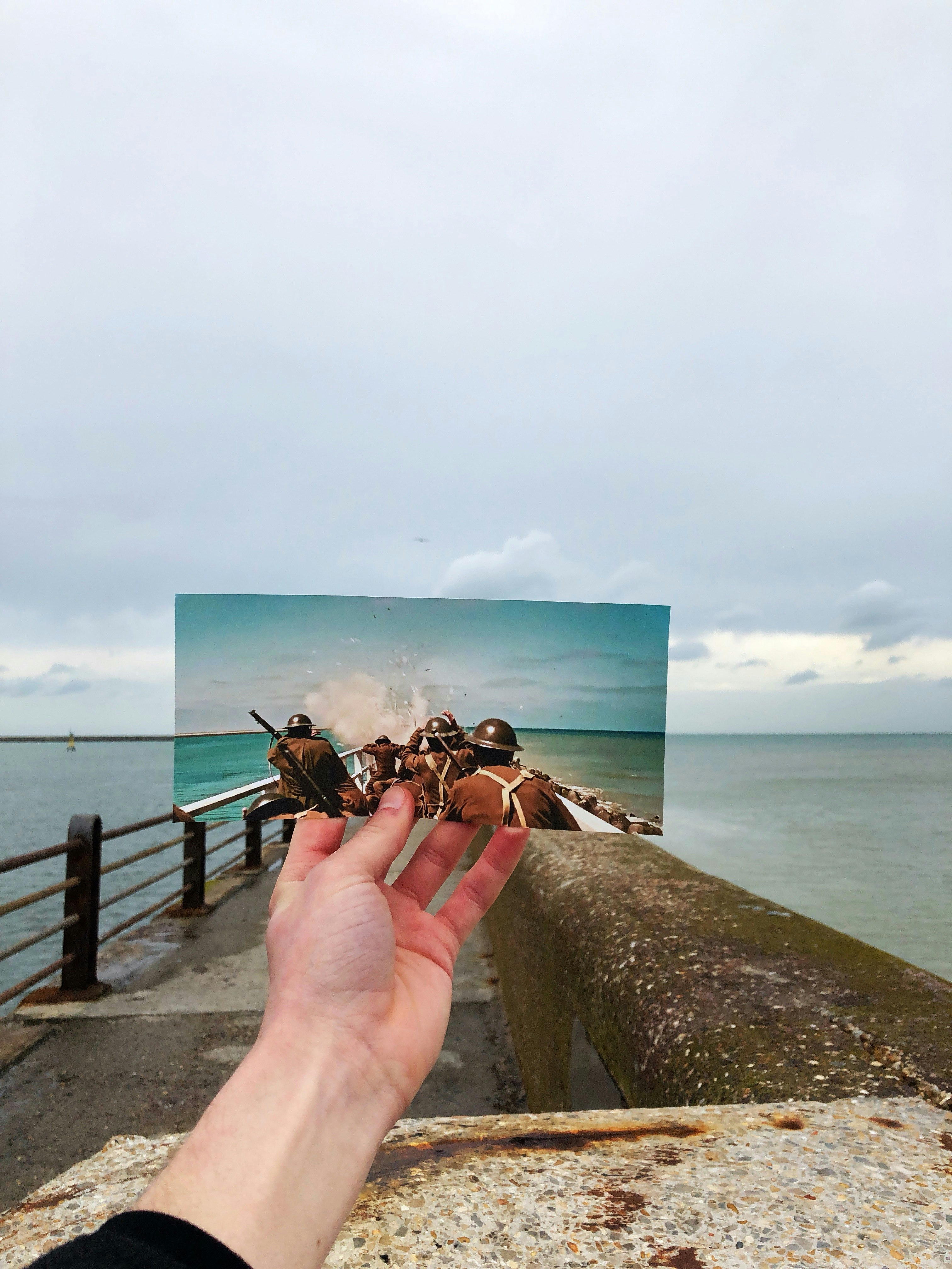 A shot taken from the movie Dunkirk lined up at the actual beach in Normandy