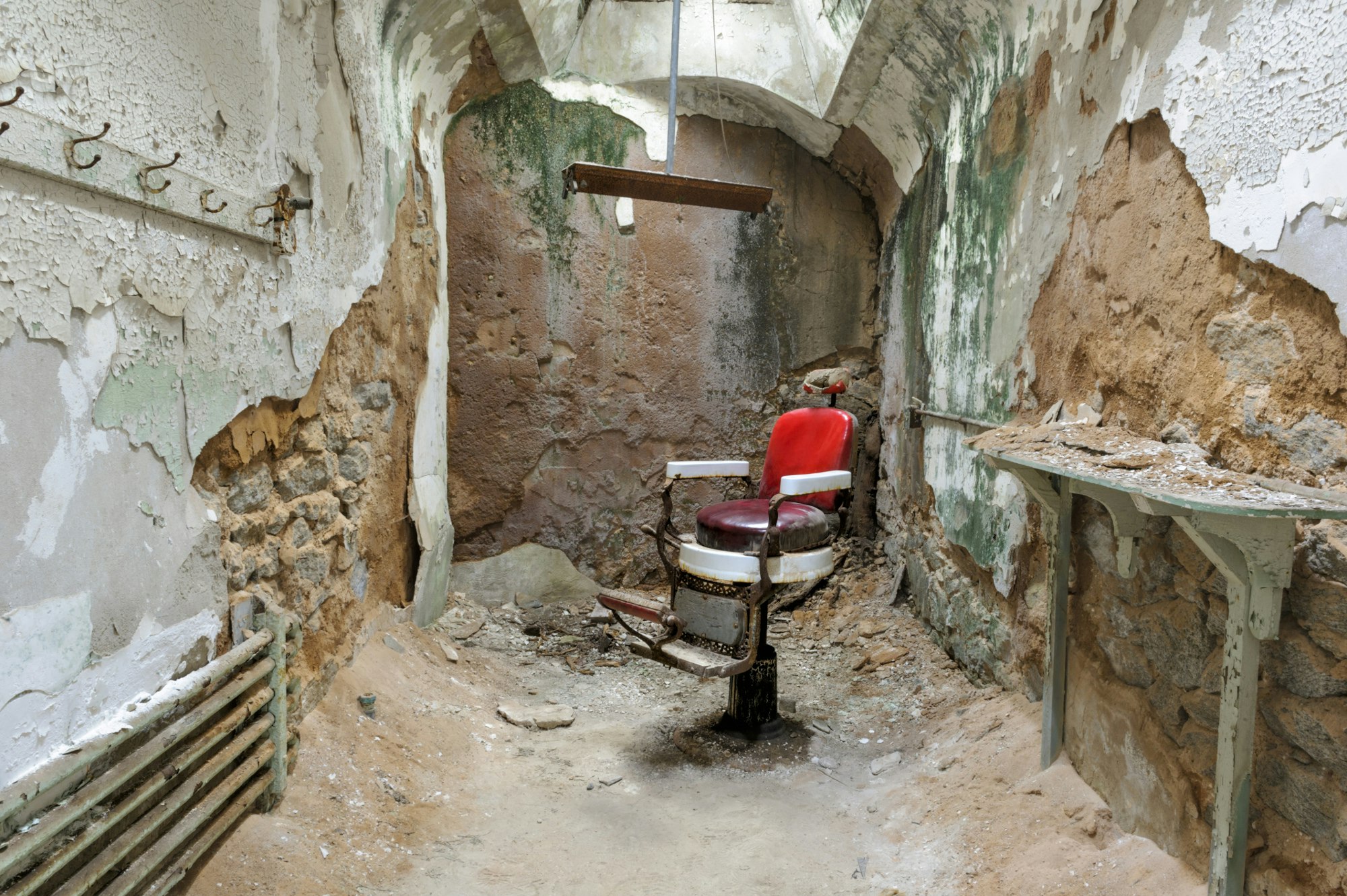 A barber's chair lies within the ruins of Eastern State Penitentiary, in Pennsylvania