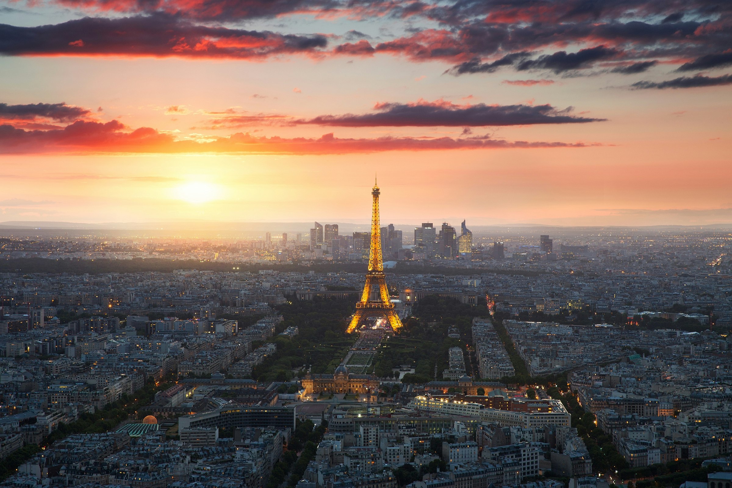 Eiffel Tower and Paris cityscape at sunset. 