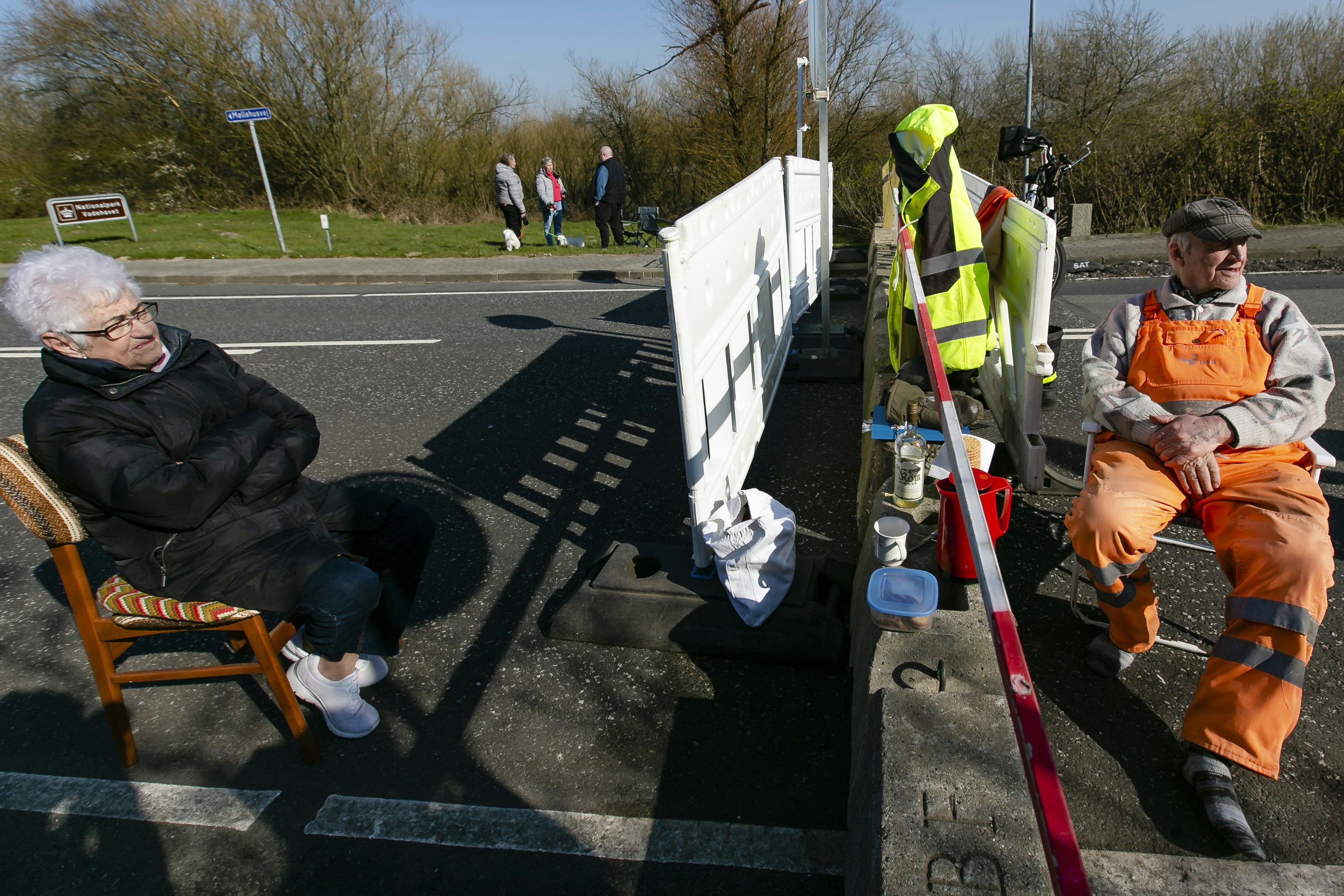 Elderly couple meet at closed border.jpg