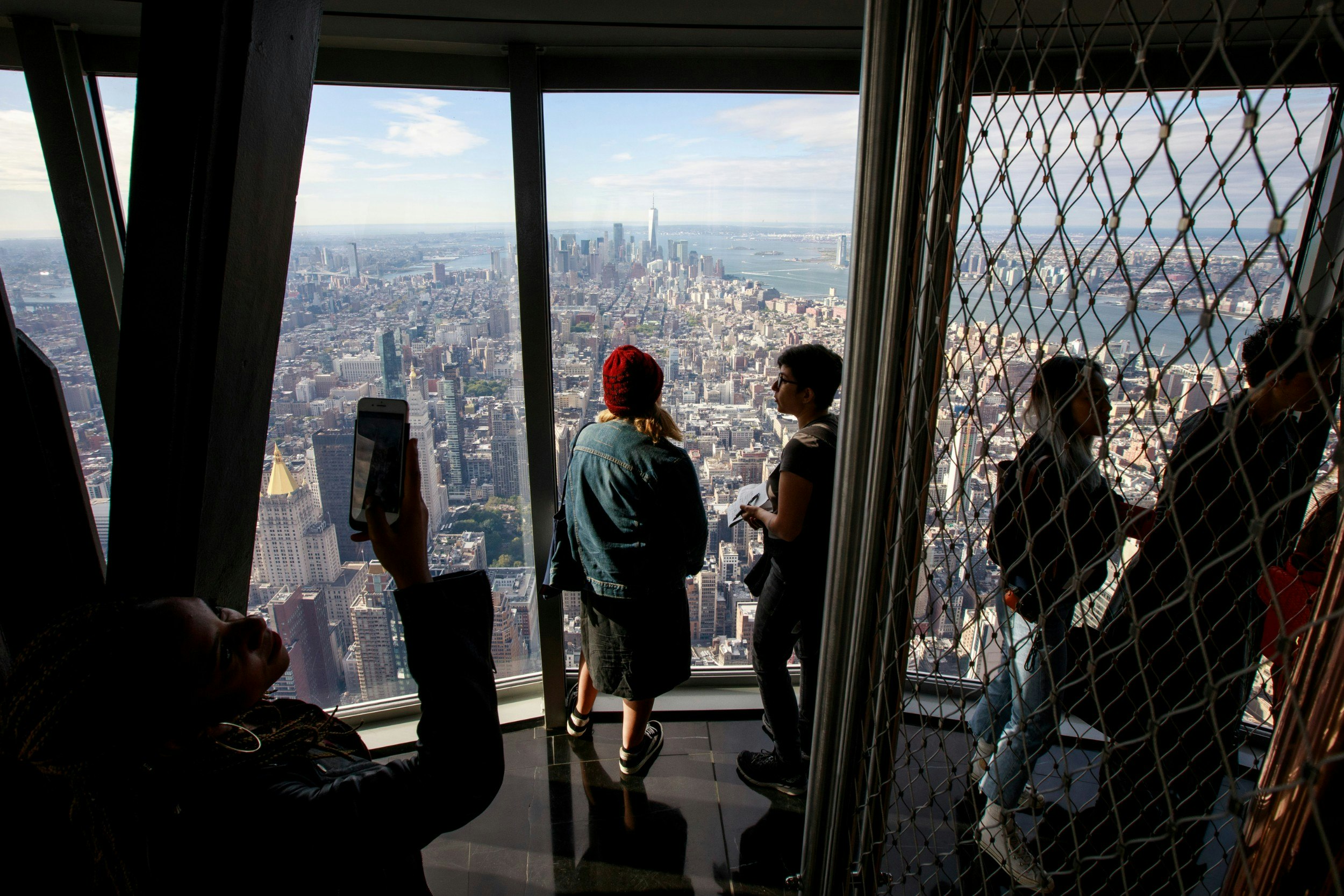 Visitors walk through the newly renovated 102nd floor Observatory at the Empire State Building