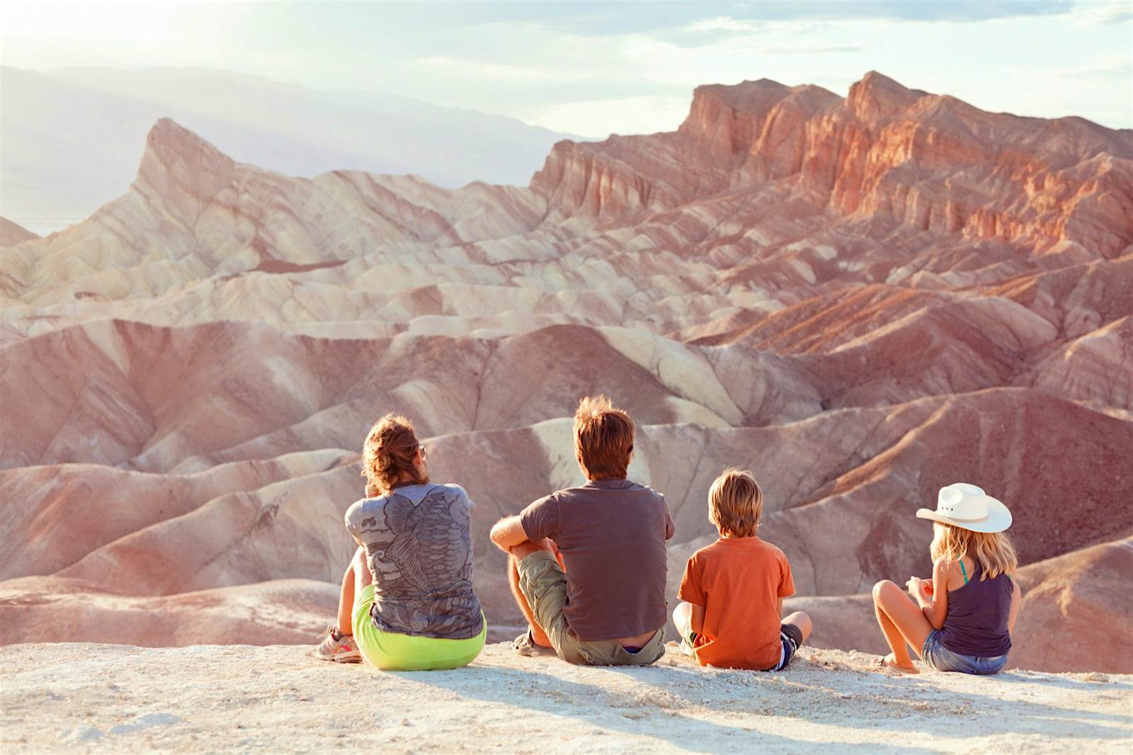A family of four admires the view at Death Valley A family of four admires the view at Death Valley