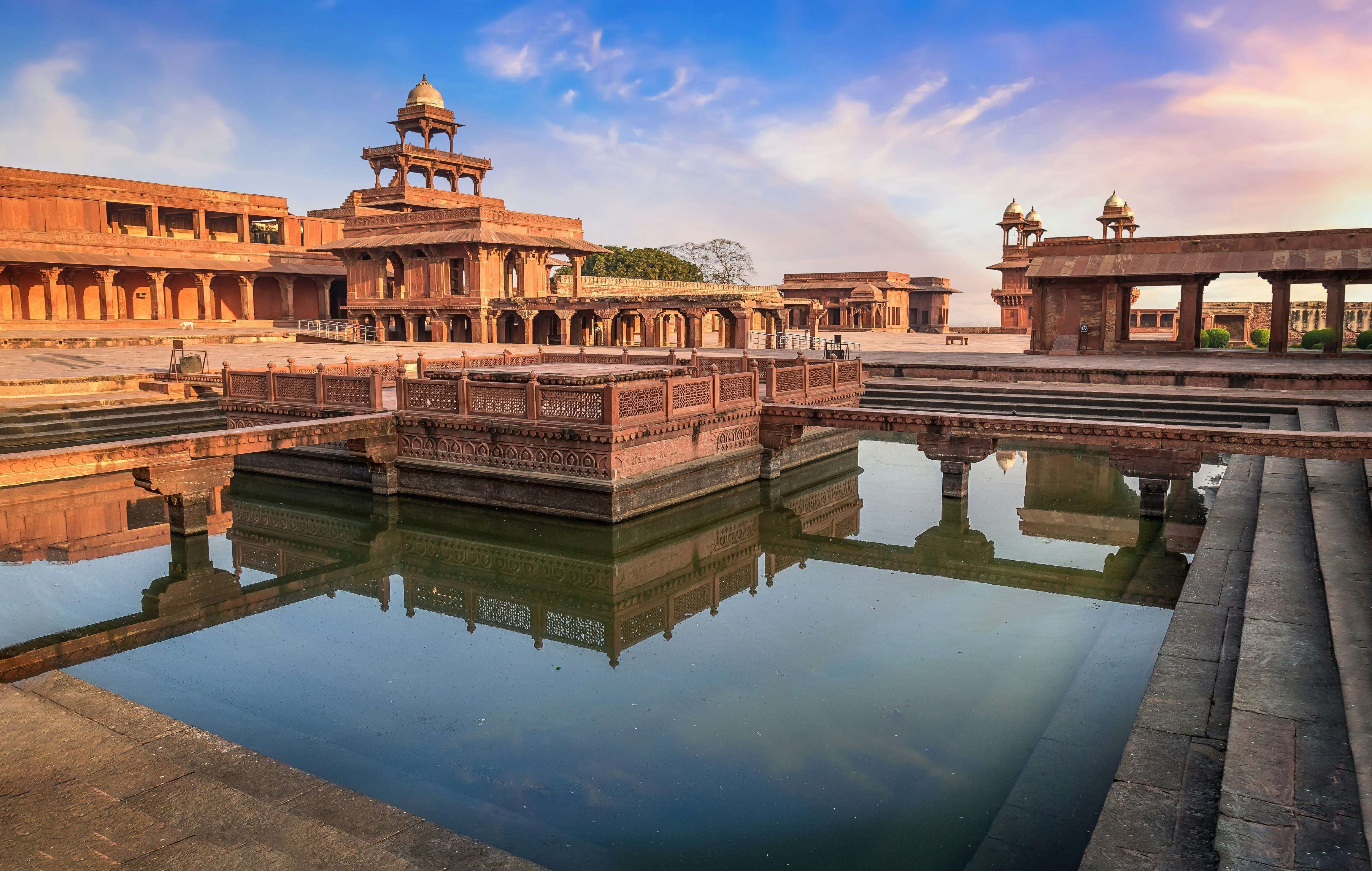 A view of the centre of Fatehpur Sikri, an abandonded Mughal city. The grand sandstone structures are surrounded by a small moat. 