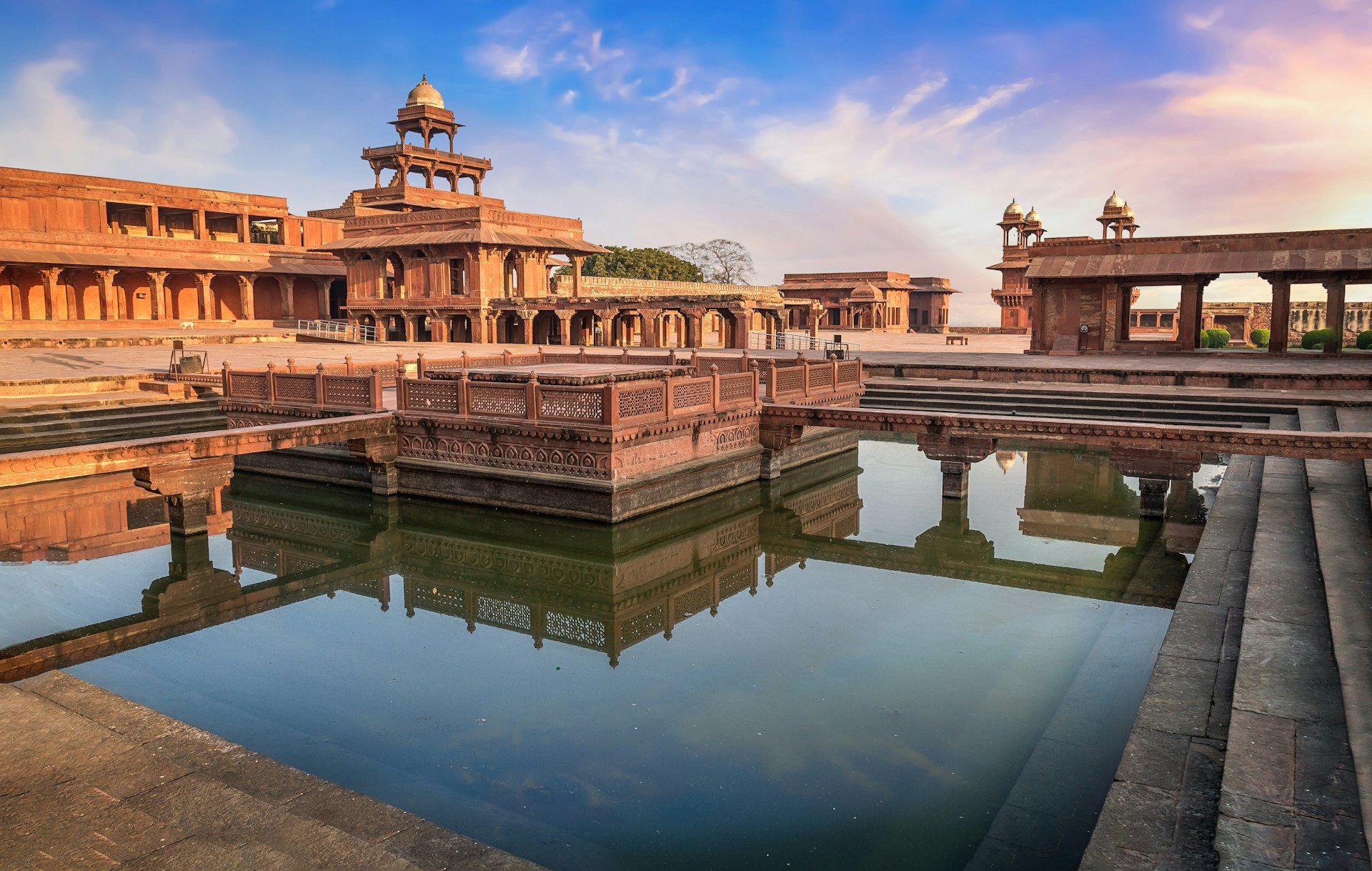A view of the centre of Fatehpur Sikri, an abandonded Mughal city. The grand sandstone structures are surrounded by a small moat. 