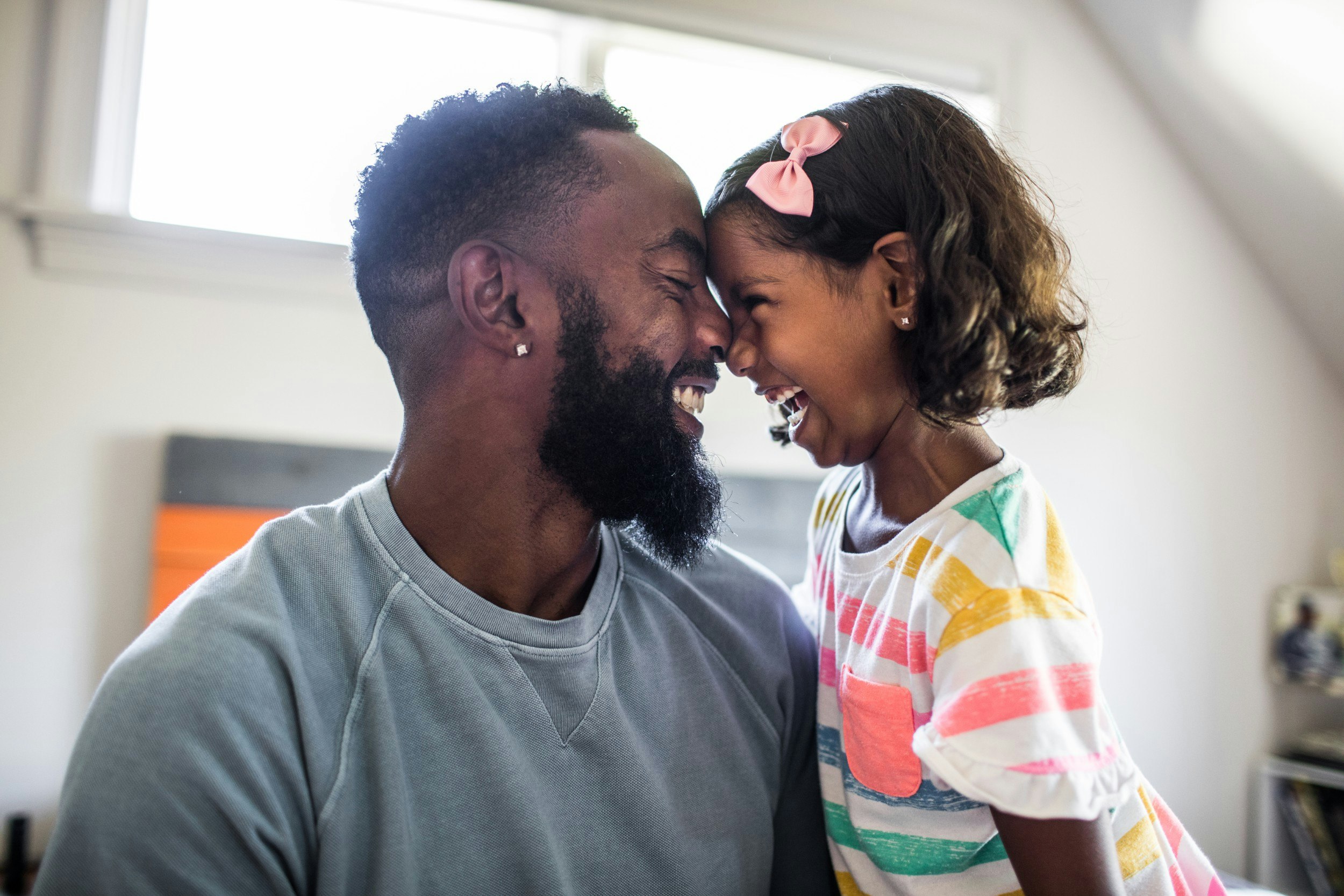 A father and daughter laughing together