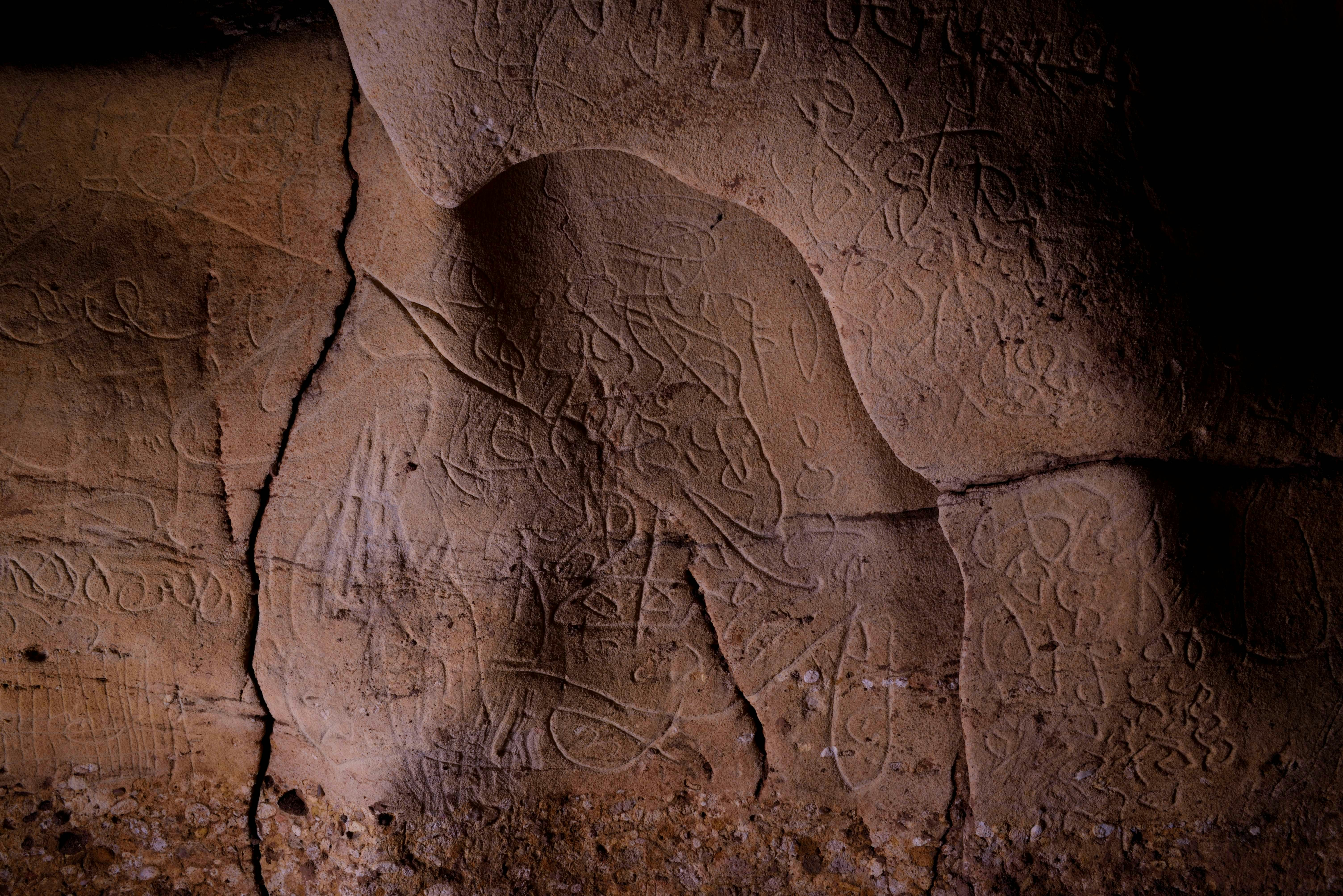 Ancient abstract drawings on the walls of a cave in Spain