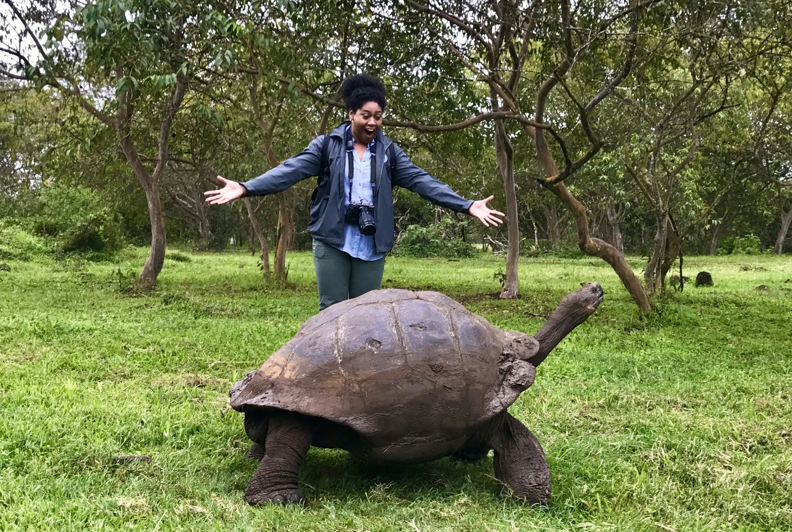 The author with a century-old Galápagos Islands tortoise