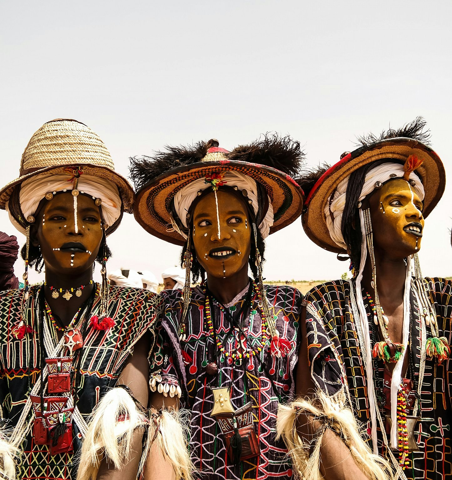 Men in costumes and makeup performing at the Gerewol Festival in Niger.