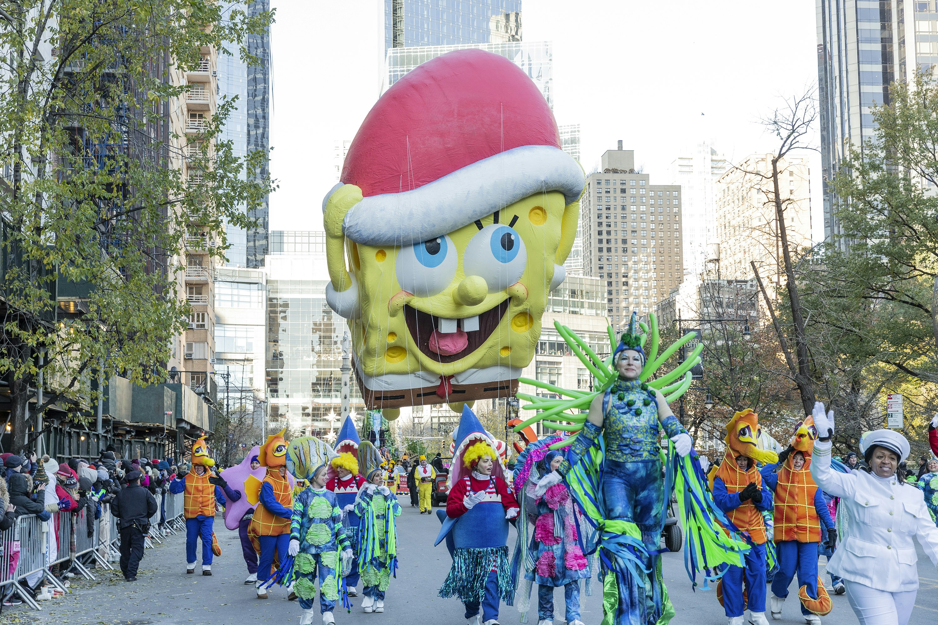 SpongeBob SquarePants giant balloon floats at 92nd Annual Macy's Thanksgiving Day Parade on the streets of Manhattan in frigid weather.