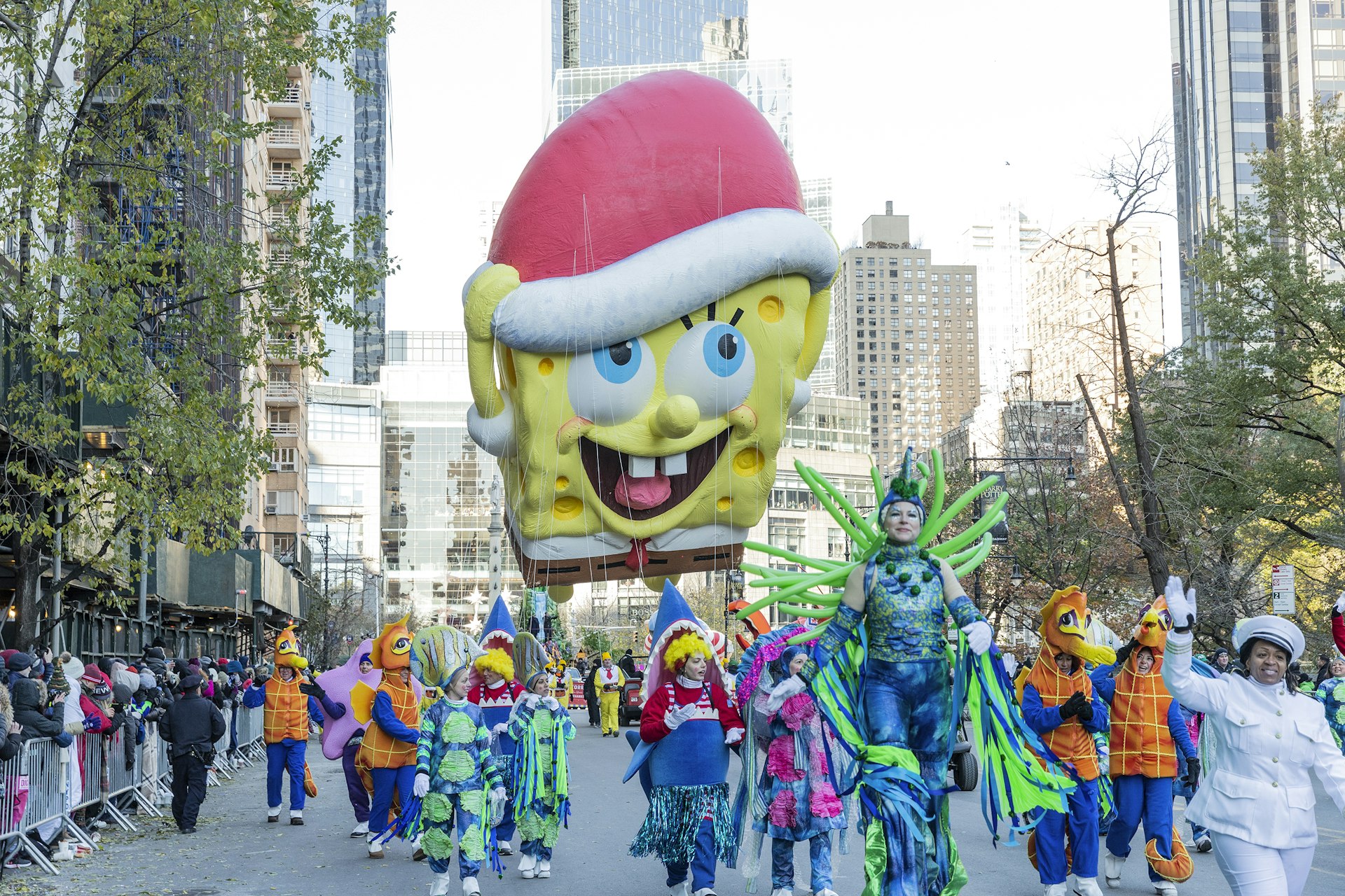 SpongeBob SquarePants giant balloon floats at 92nd Annual Macy's Thanksgiving Day Parade on the streets of Manhattan in frigid weather.