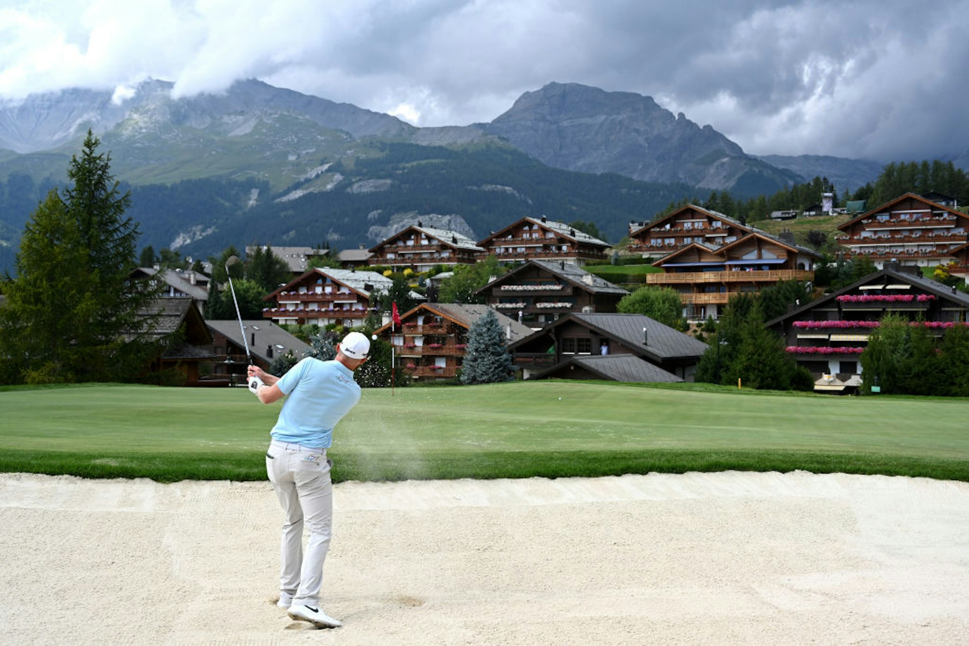 Sebastian Soderberg of Sweden plays a bunker shot on the fourteenth during Day Four of the Omega European Masters at Crans Montana Golf Club 