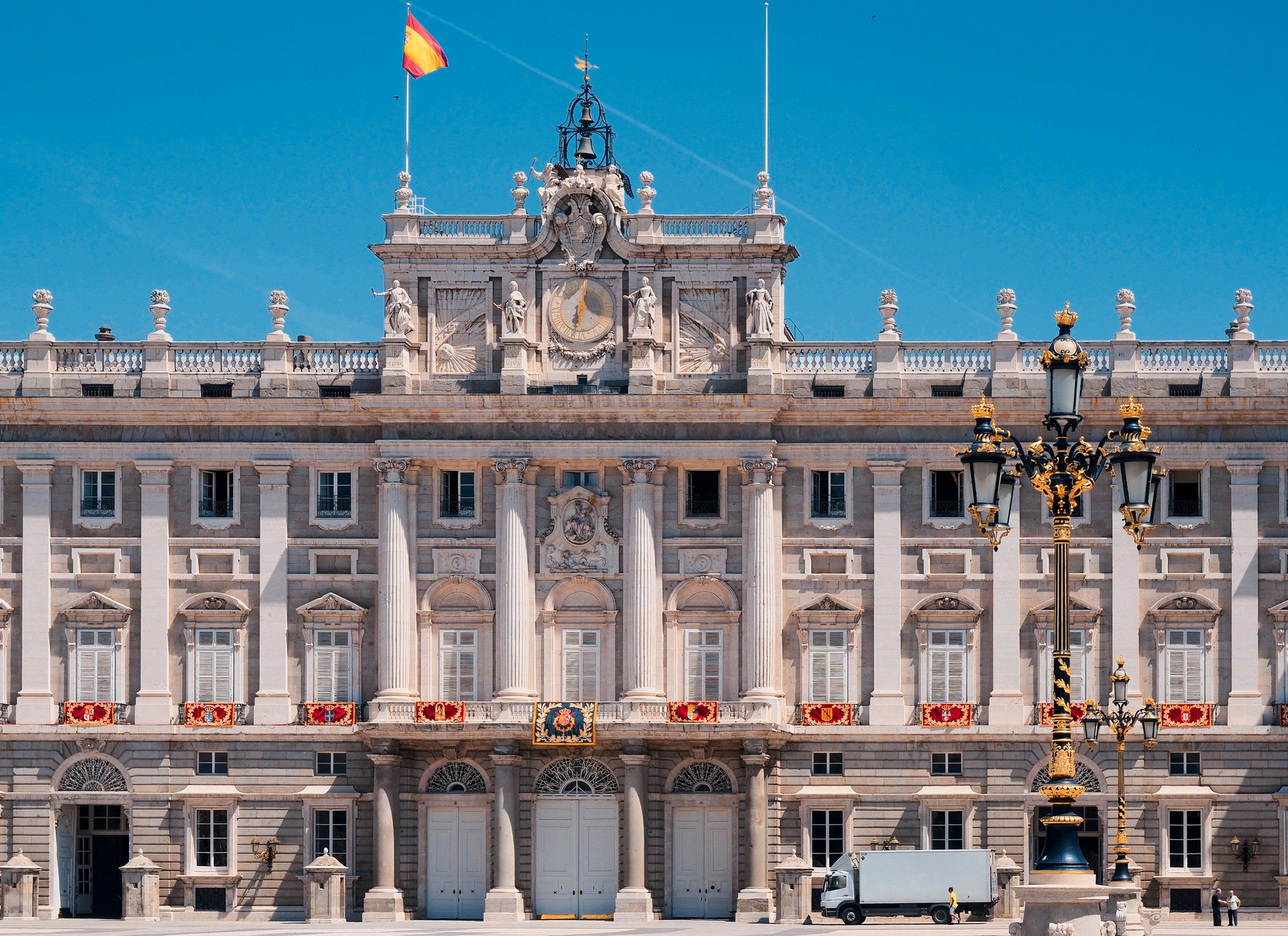An up-close view of the Royal Palace or Palacio Real in Madrid on a cloudless day