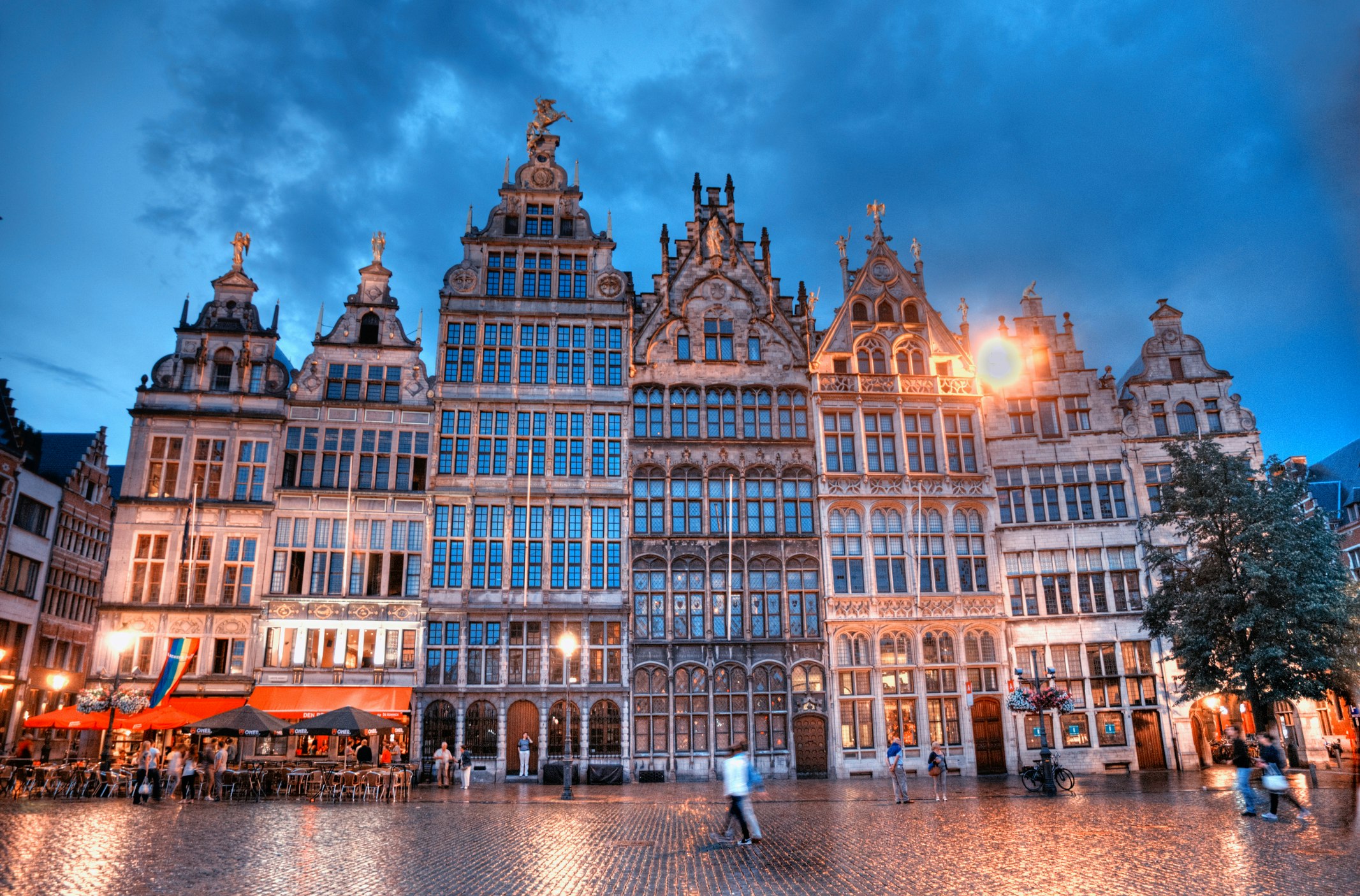 Houses of the Guilds at the Grote Markt in Antwerp, Belgium under a pink evening sky