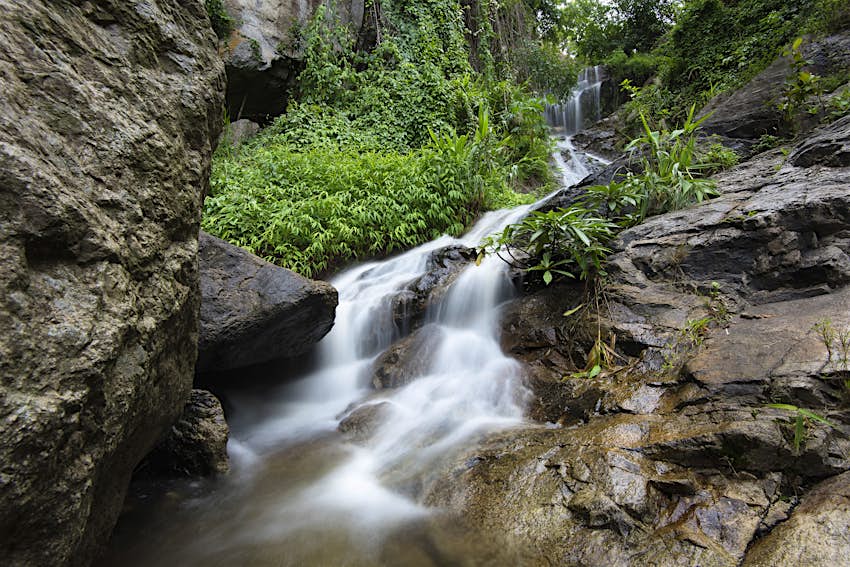 Huay Kaew Waterfall Chiang Mai Huay Kaew Waterfall: streams of white water cascade down rocks in a jungle setting