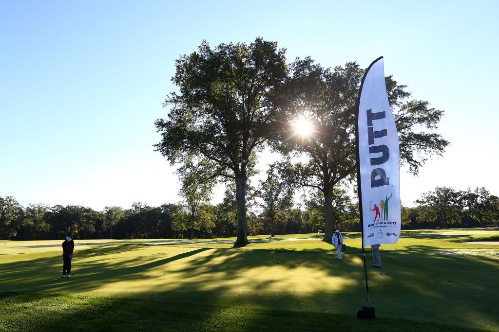 A genral view of the Drive, Chip and Putt Championship at Winged Foot Golf Club, the sun peeking through two trees