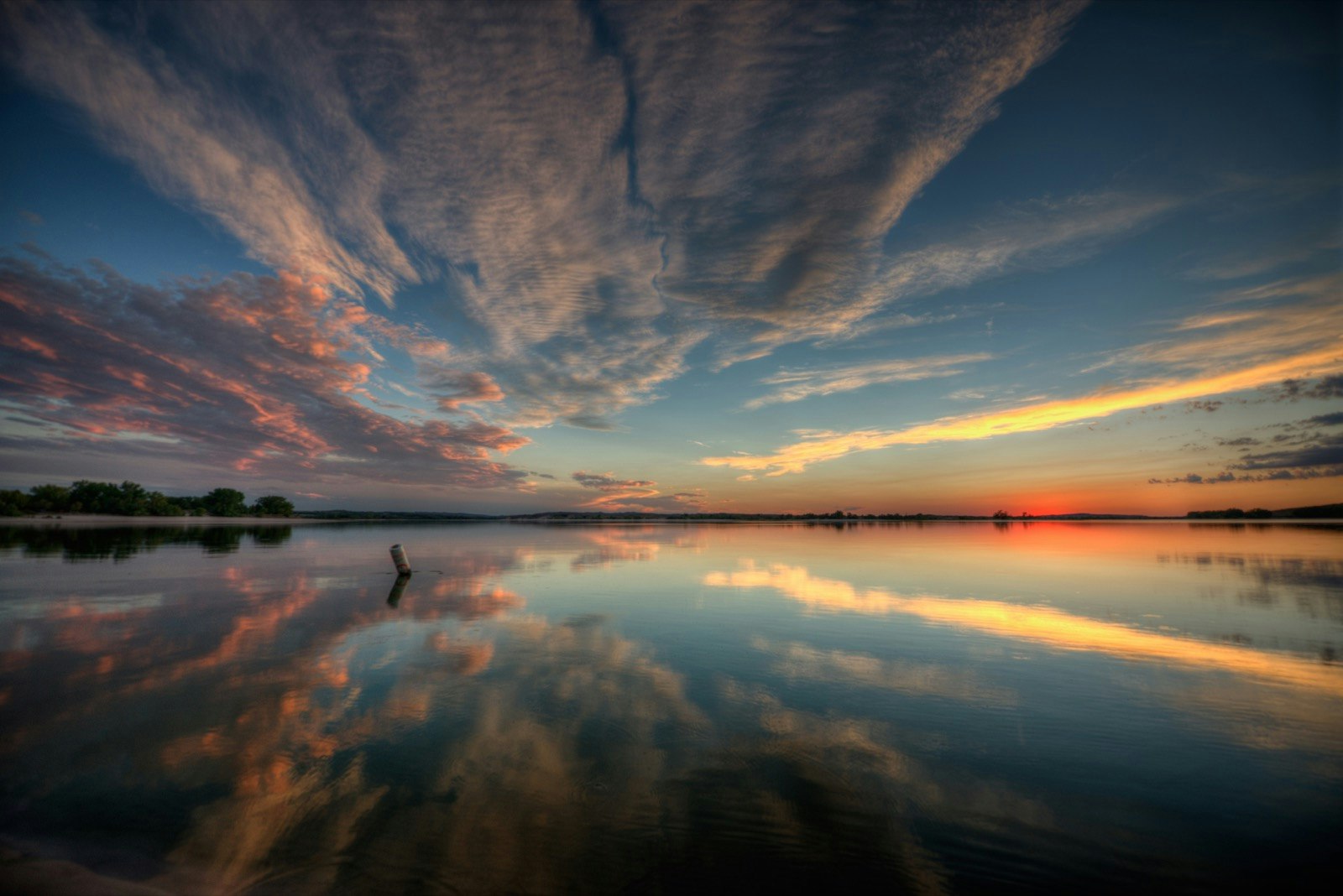 Clouds reflected in a lake at sunset in Nebraska