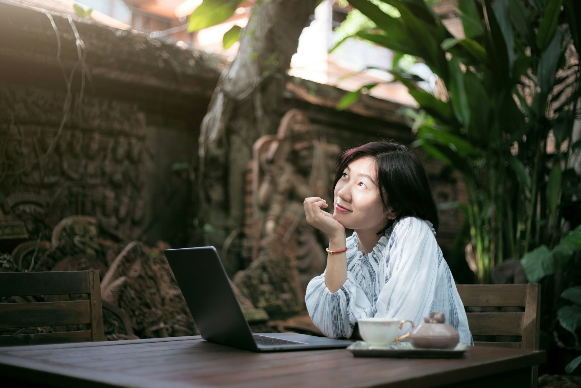 woman with laptop daydreaming.jpg