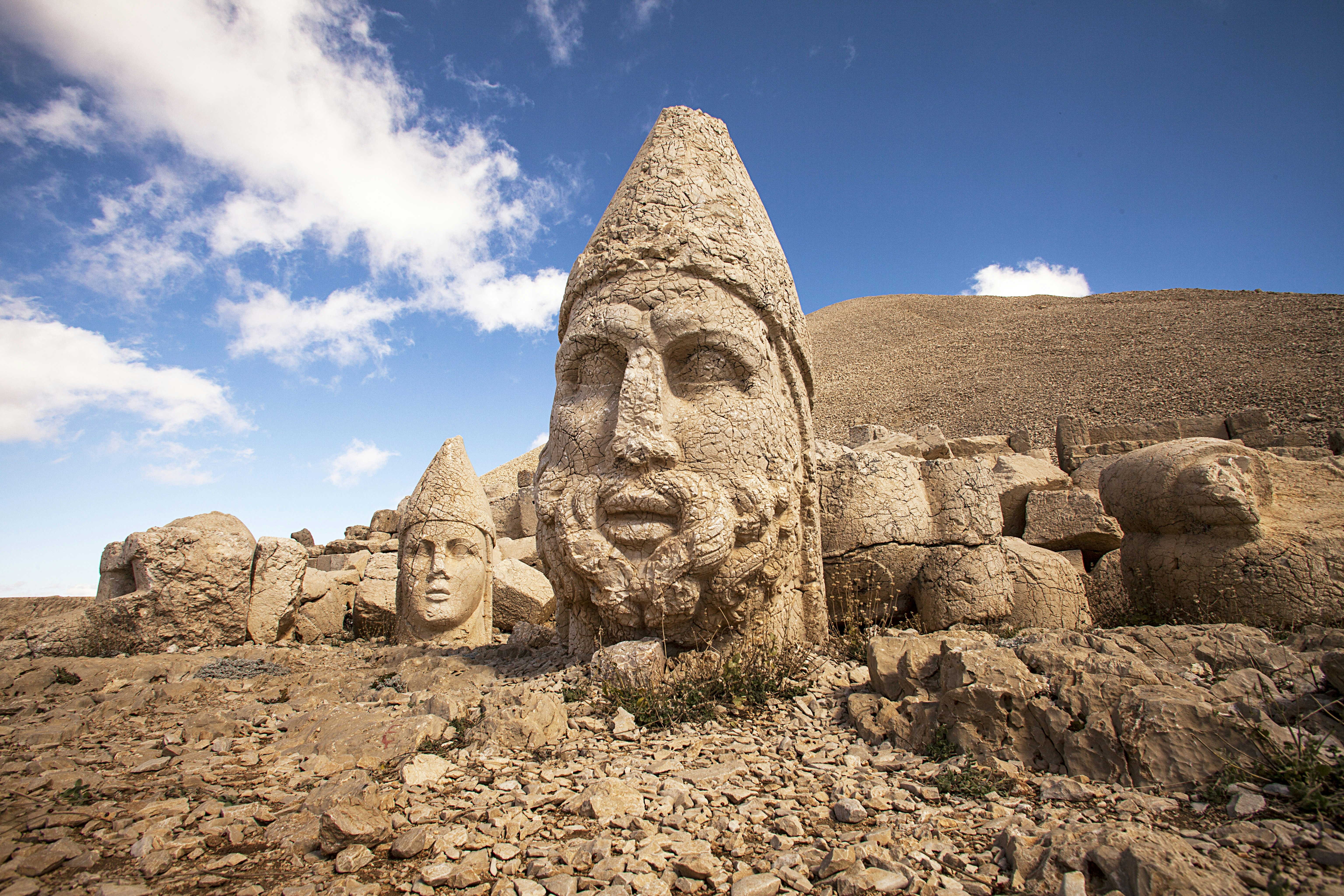 Huge heads of two stone statues on a mountaintop at Nemrut Dağı, Turkey