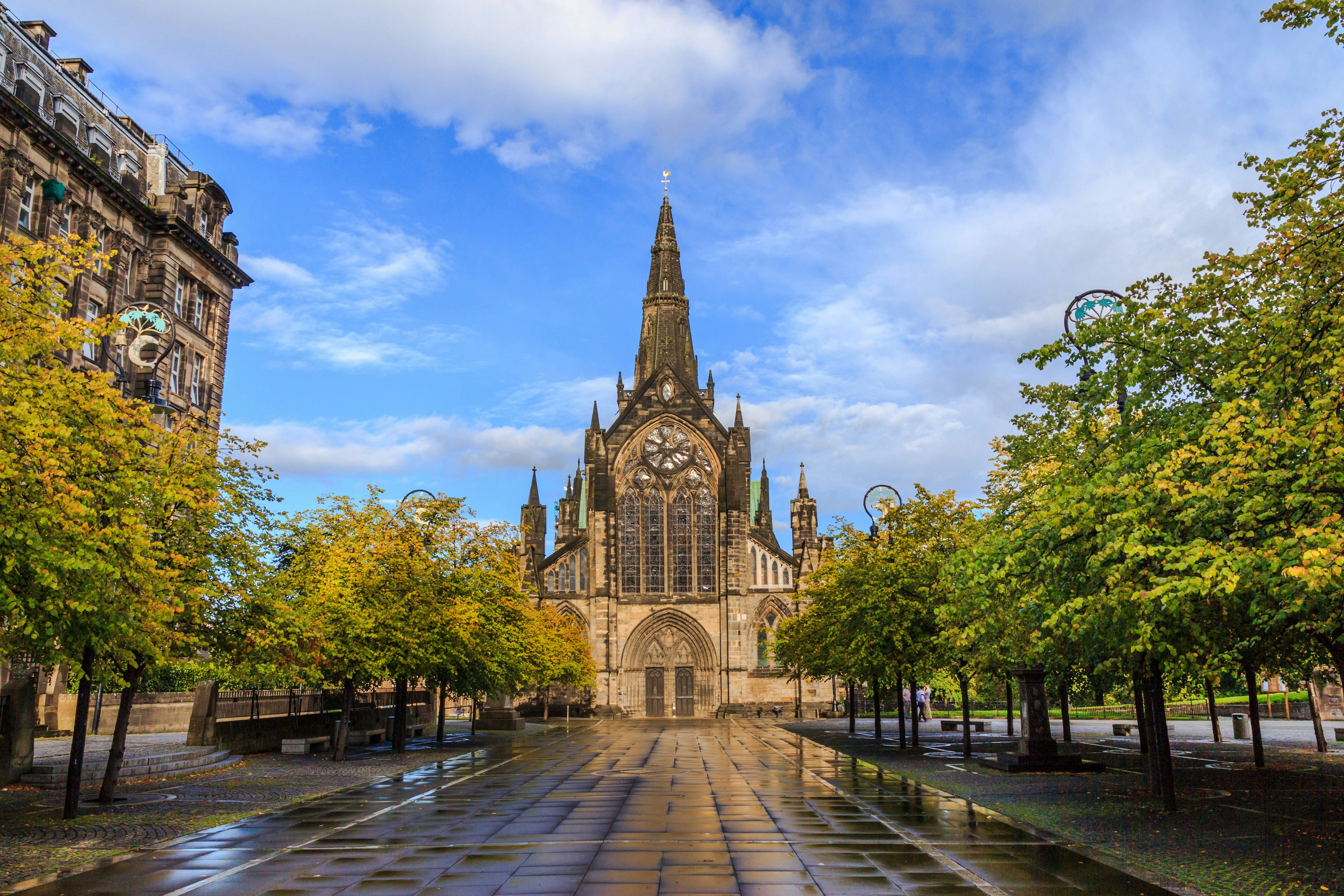 The facade of Glasgow Cathedral, a stone Gothic structure, after rain.