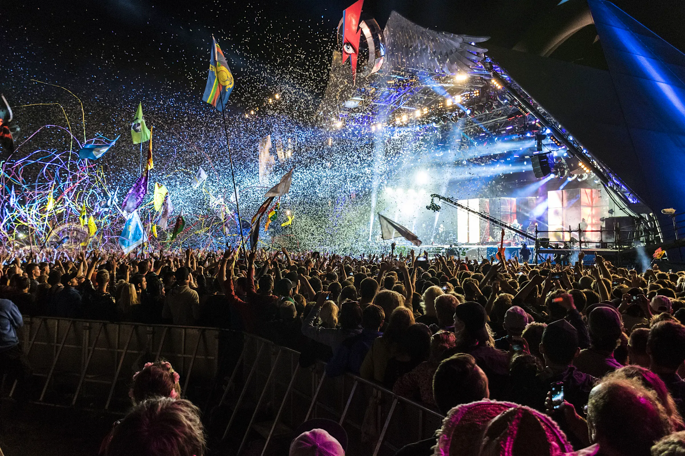 An explosion of confetti, tape and light from a pyramid shaped stage at Glastonbury Festival. An explosion of confetti, tape and light from a pyramid shaped stage at Glastonbury Festival.