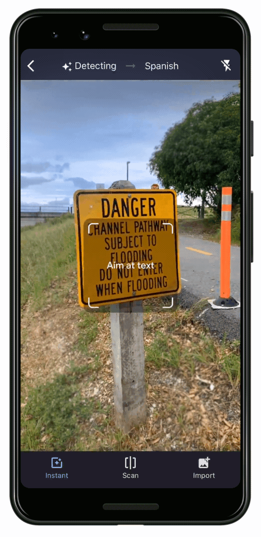 A gif of Google Translate's camera function, translating a picture of a sign