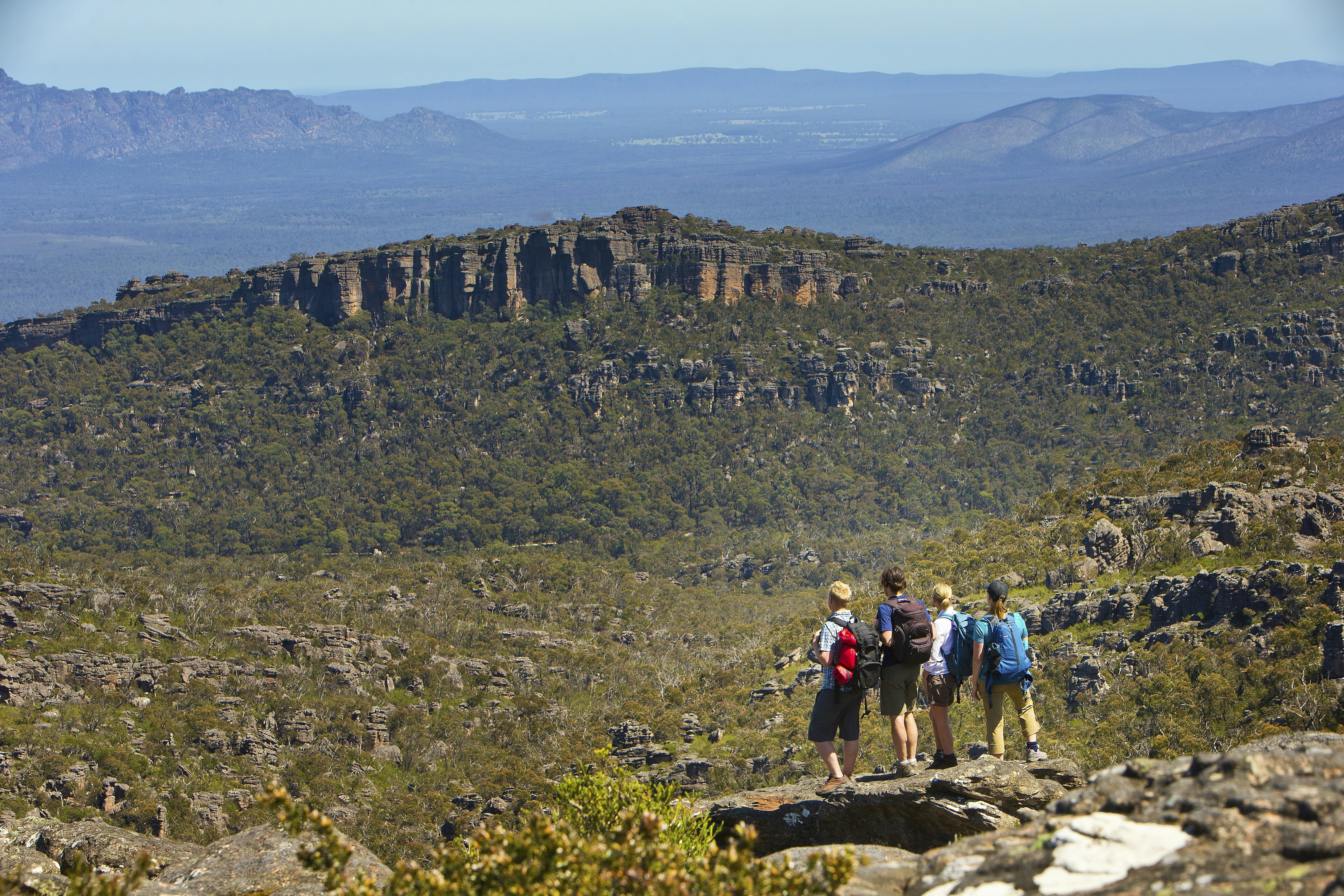 People on Grampians Peaks Trail on a clear day in Grampians National Park, Victoria 