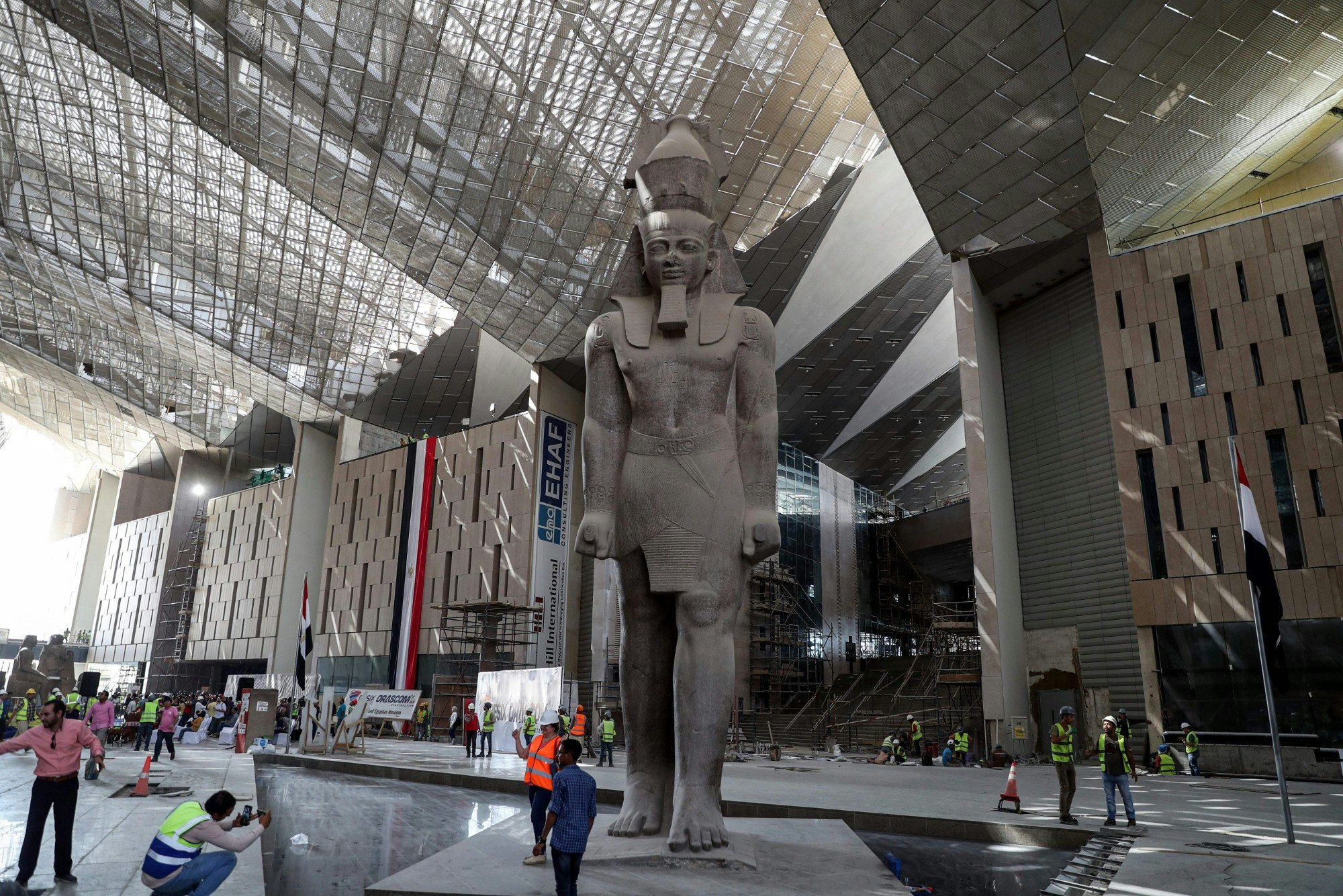 view of the colossus of ancient Egyptian Pharaoh Ramses II, at its permanent display spot amidst construction work .jpg