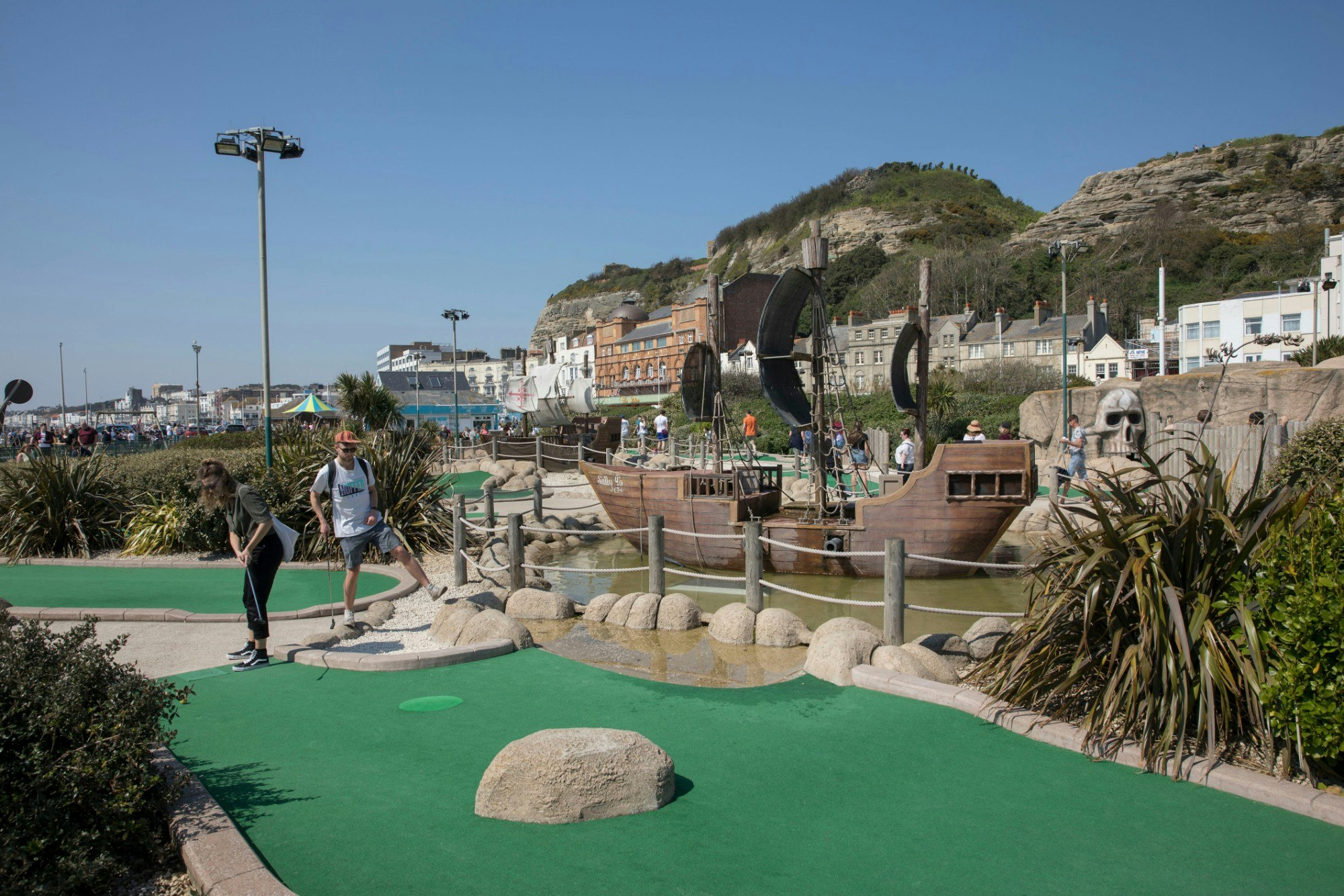 A couple play miniature golf in Hastings.jpg
