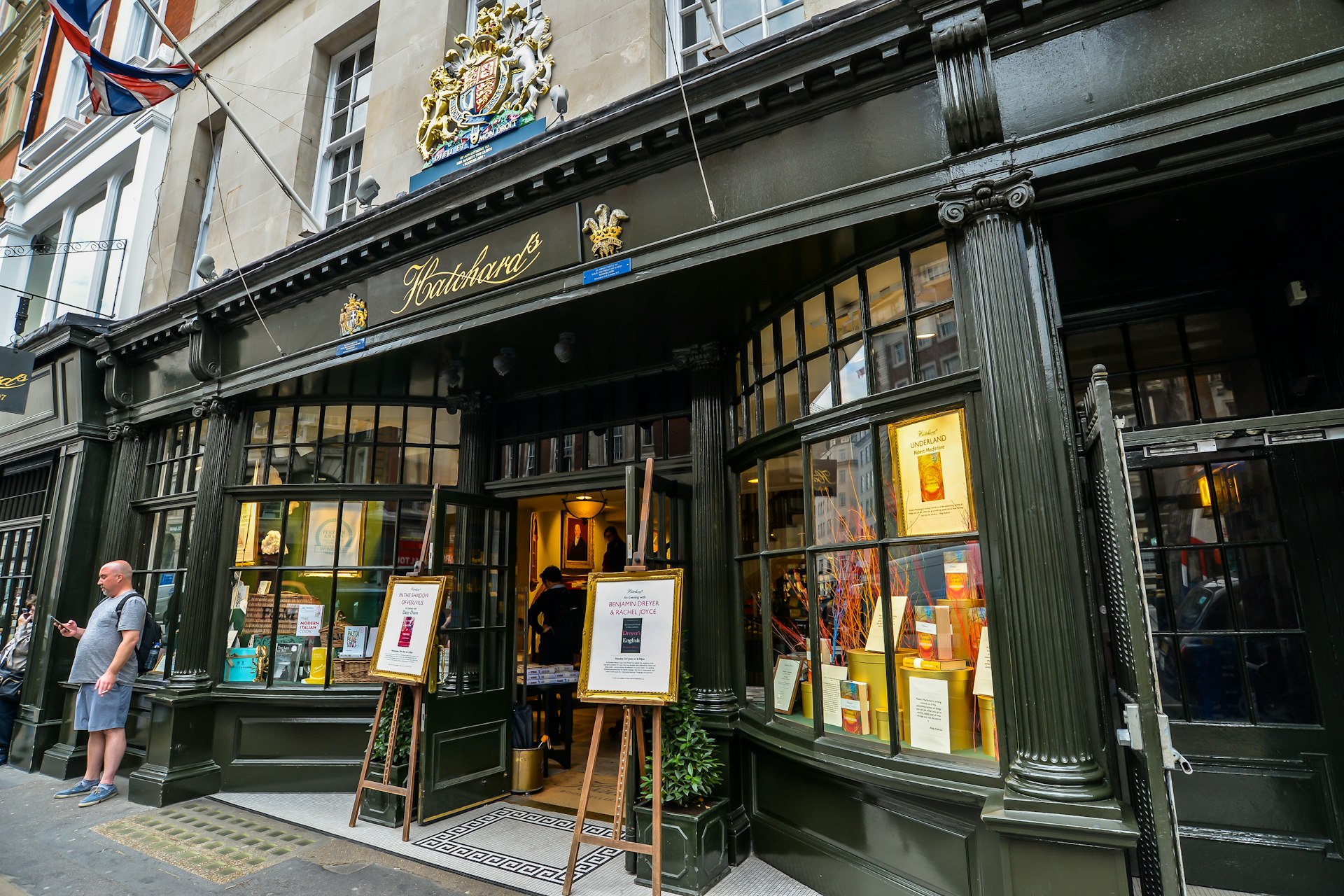 The outside of Hatchards, London. Two easels hold cards advertising an event. 