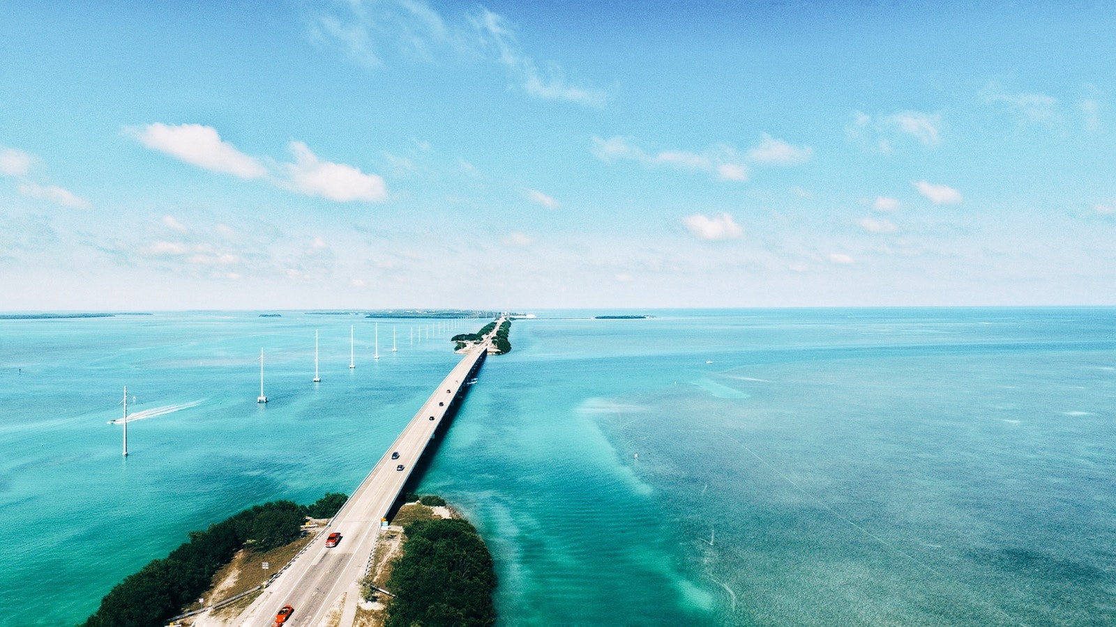 Long highway through clear blue waters connecting the Florida Keys