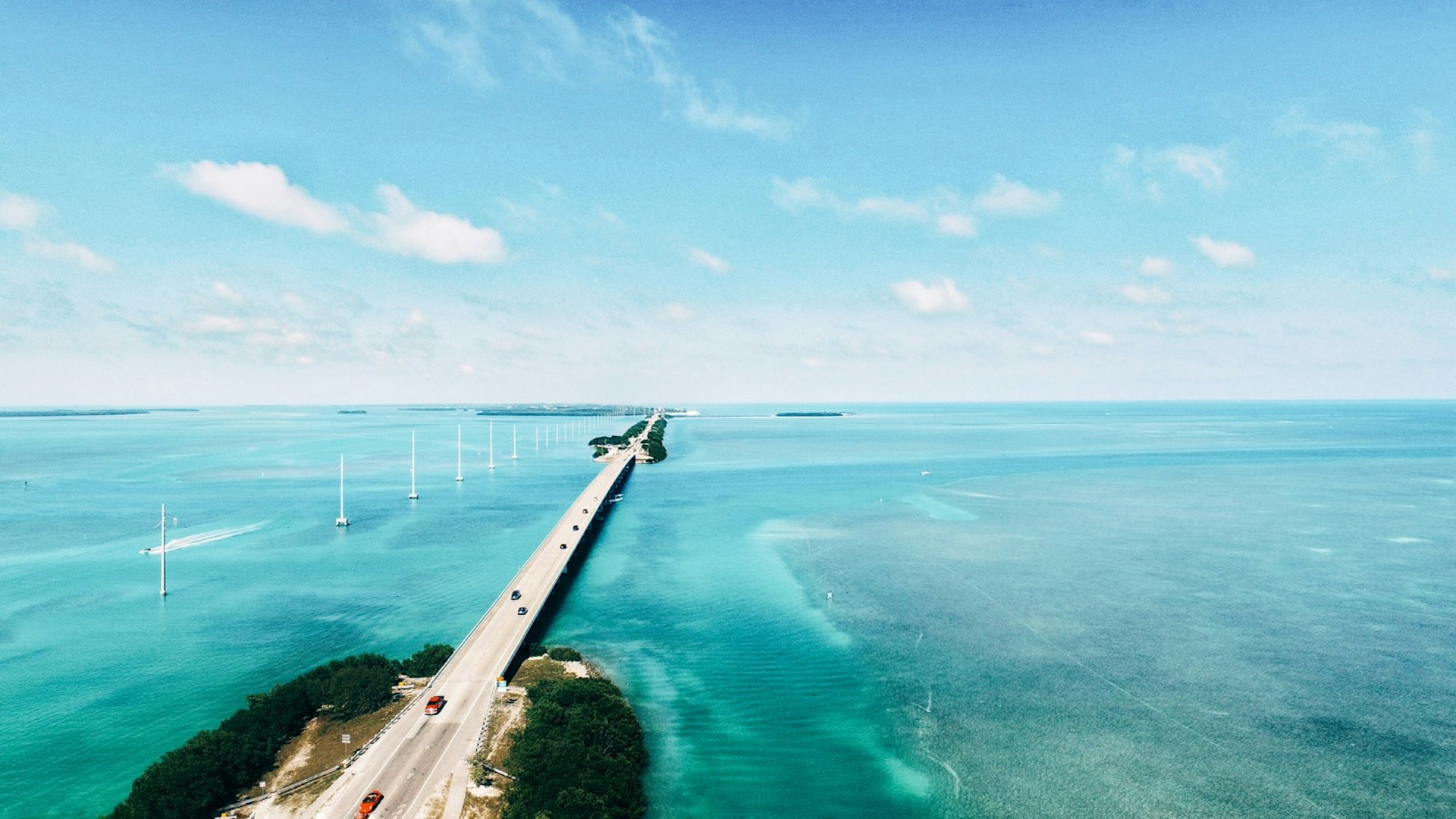 Long highway through clear blue waters connecting the Florida Keys