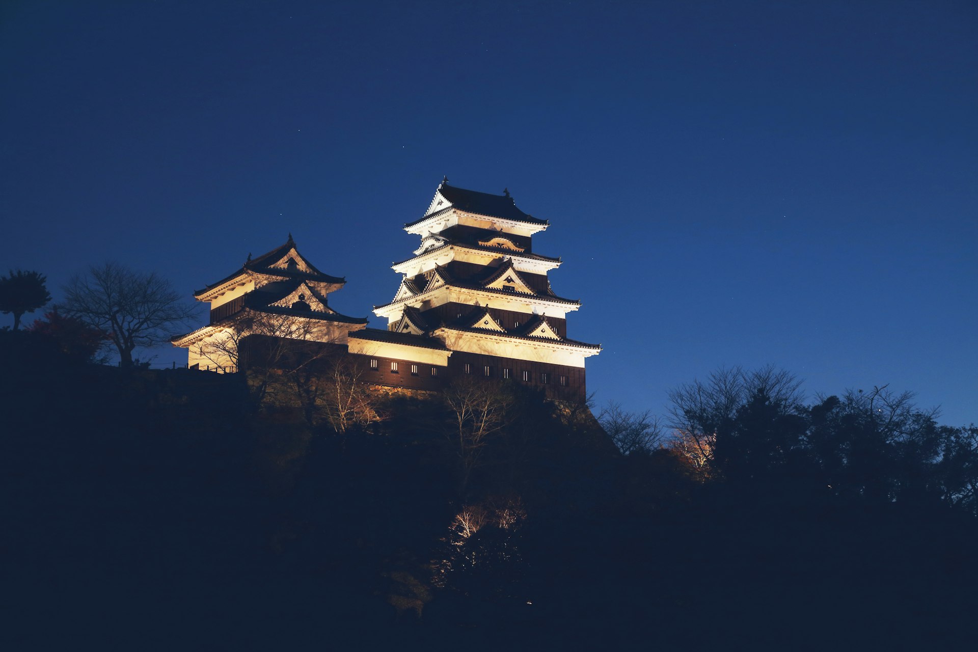 Exterior shot of Ozu Castle, Japan against a blue sky background