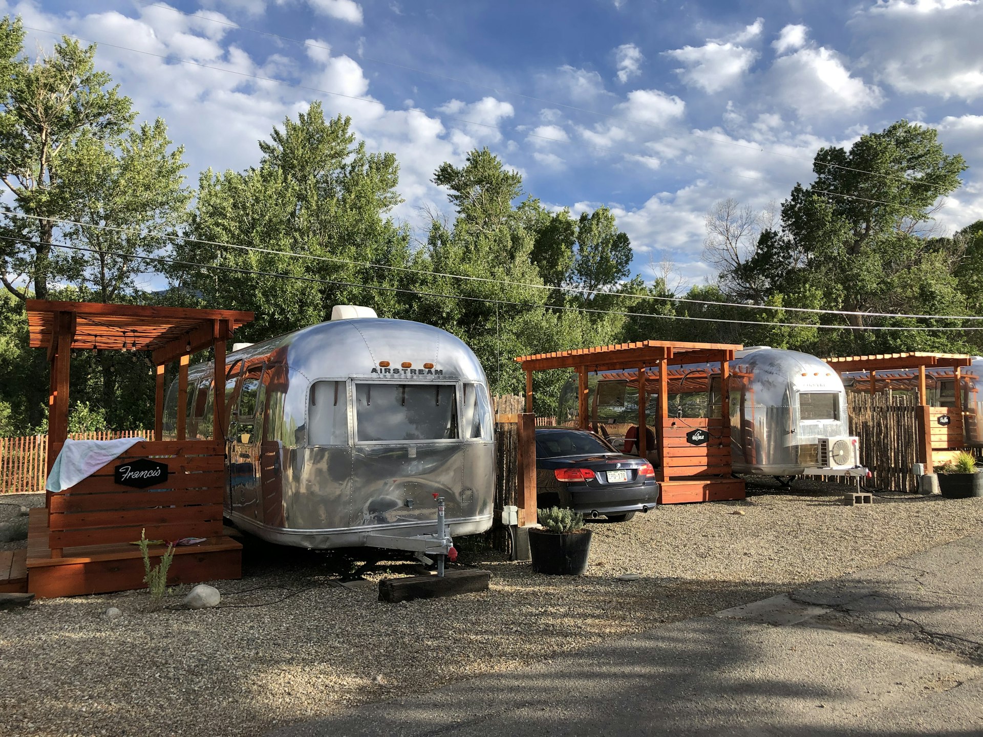 A line of airstream trailers with attached decks at the Amigo Motor Lodge